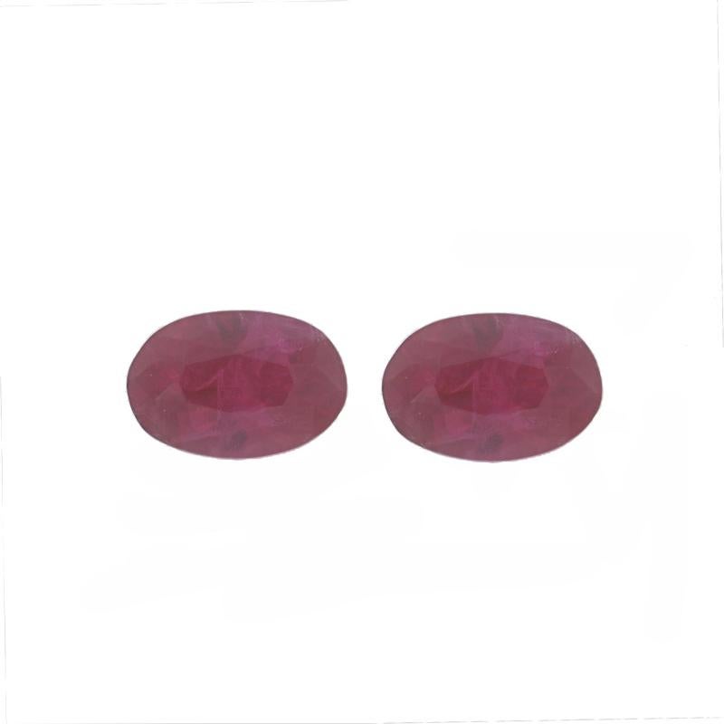 Treatment: Heating
Total Carats: .84ctw
Cut: Oval
Color: Red

Measurements
Stone 1 (mm): 5.77 x 3.91 x 2.56
Stone 2 (mm): 5.70 x 3.86 x 2.37

Condition: New 