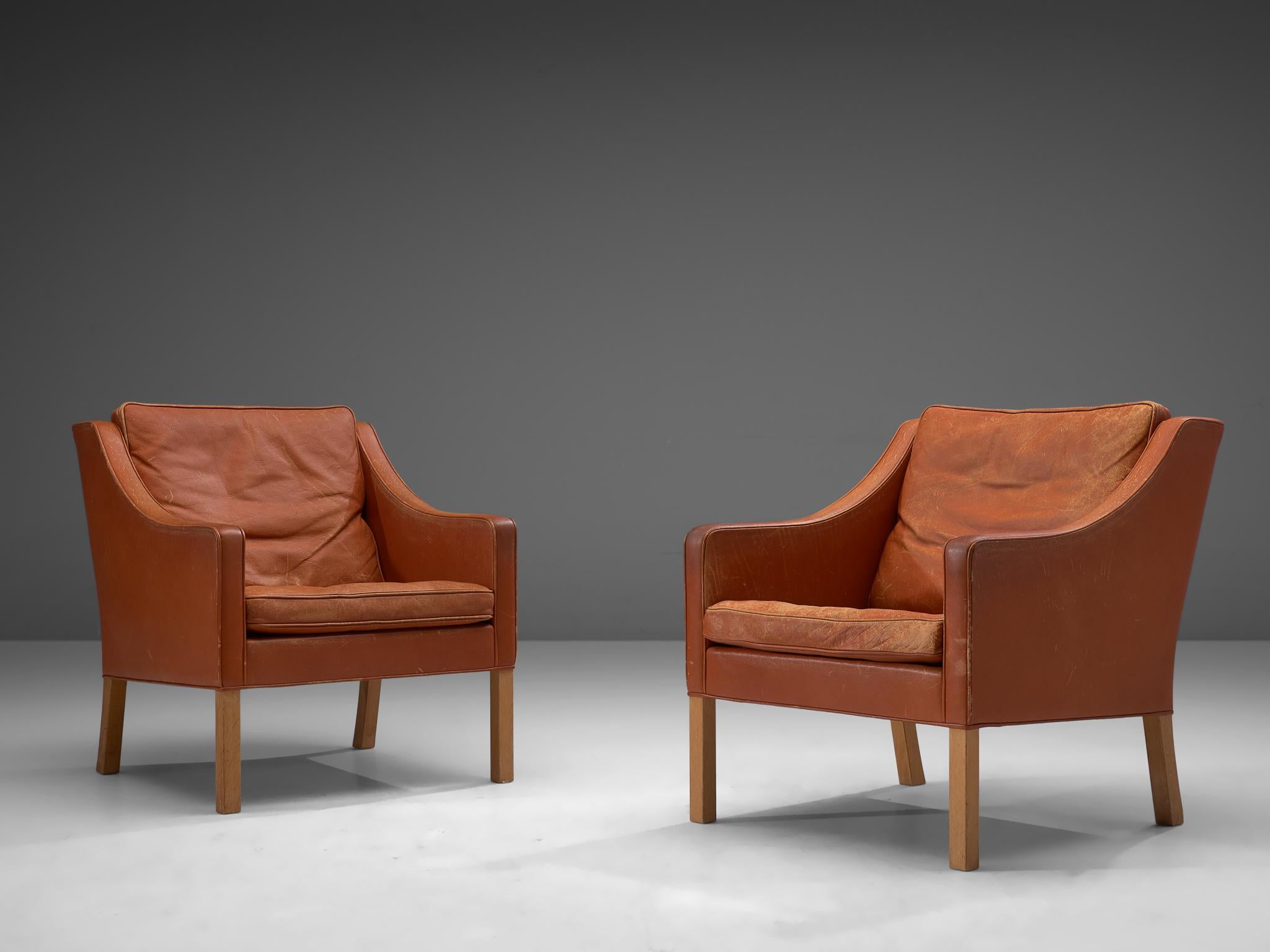 Set of 2 lounge chairs in original leather and oak, by Børge Mogensen for Fredericia Møbelfabrik, Denmark

This set is quintessentially Danish. Comfortable, well made and simplistic in design yet rich in use of material and finished. The set