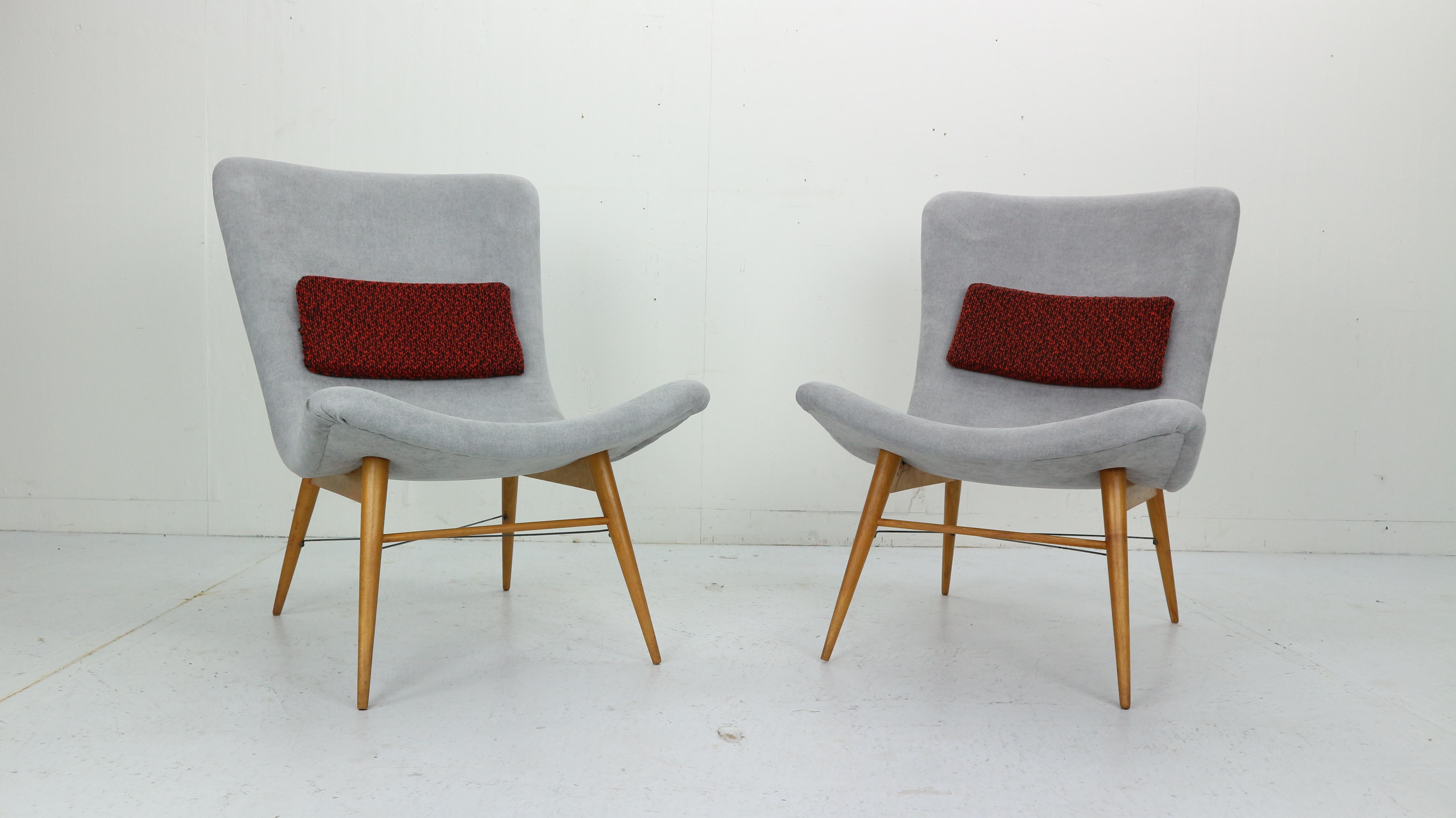 Set of two lounge chairs by Miroslav Navratil, manufactured in former Czechoslovakia by Cesky Nabytek, 1959s.
Original wooden base.
Both chairs have been newly reupholstered with light gray fabric. The little cushions are still having an original