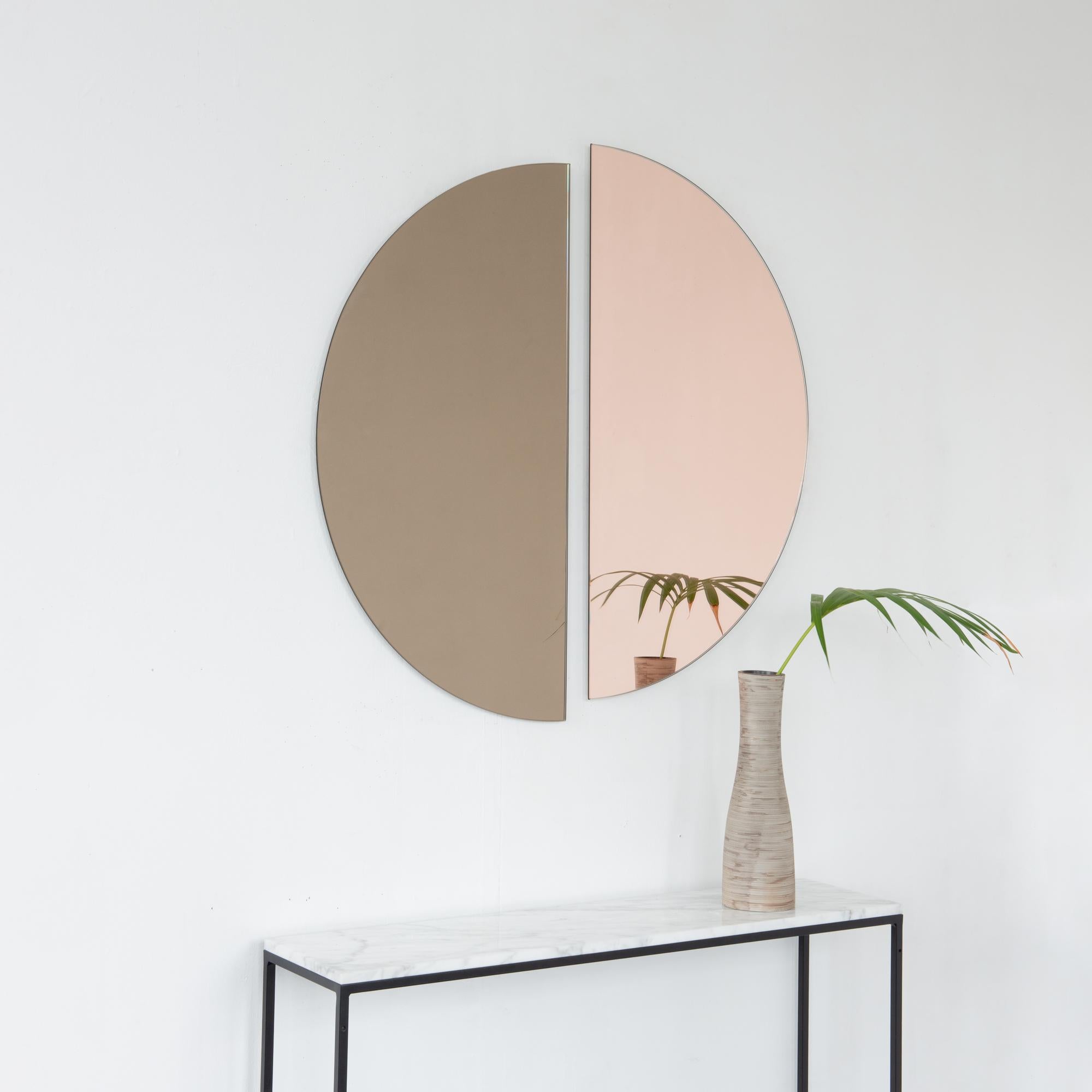 Set of two minimalist half-moon Luna™ bronze + rose gold (peach) tinted frameless mirrors with a floating effect. Fitted with a quality hanging system for a flexible installation in 4 different directions. Designed and made in London, UK. 

Our
