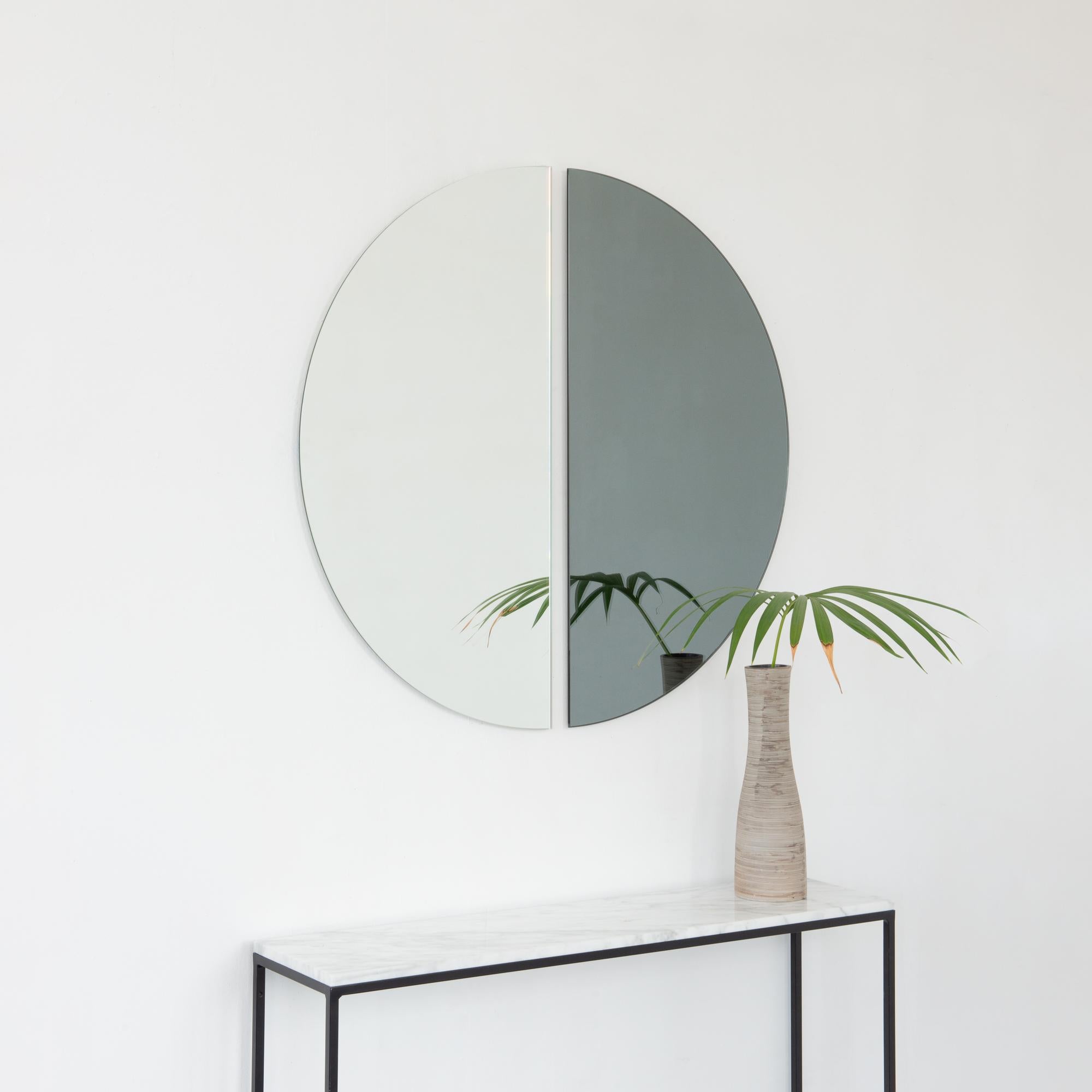 Set of two minimalist half-moon Luna™ standard silver + black tinted frameless mirrors with a floating effect. Fitted with a quality and ingenious hanging system for a flexible installation in 4 different directions. Designed and made in London, UK.