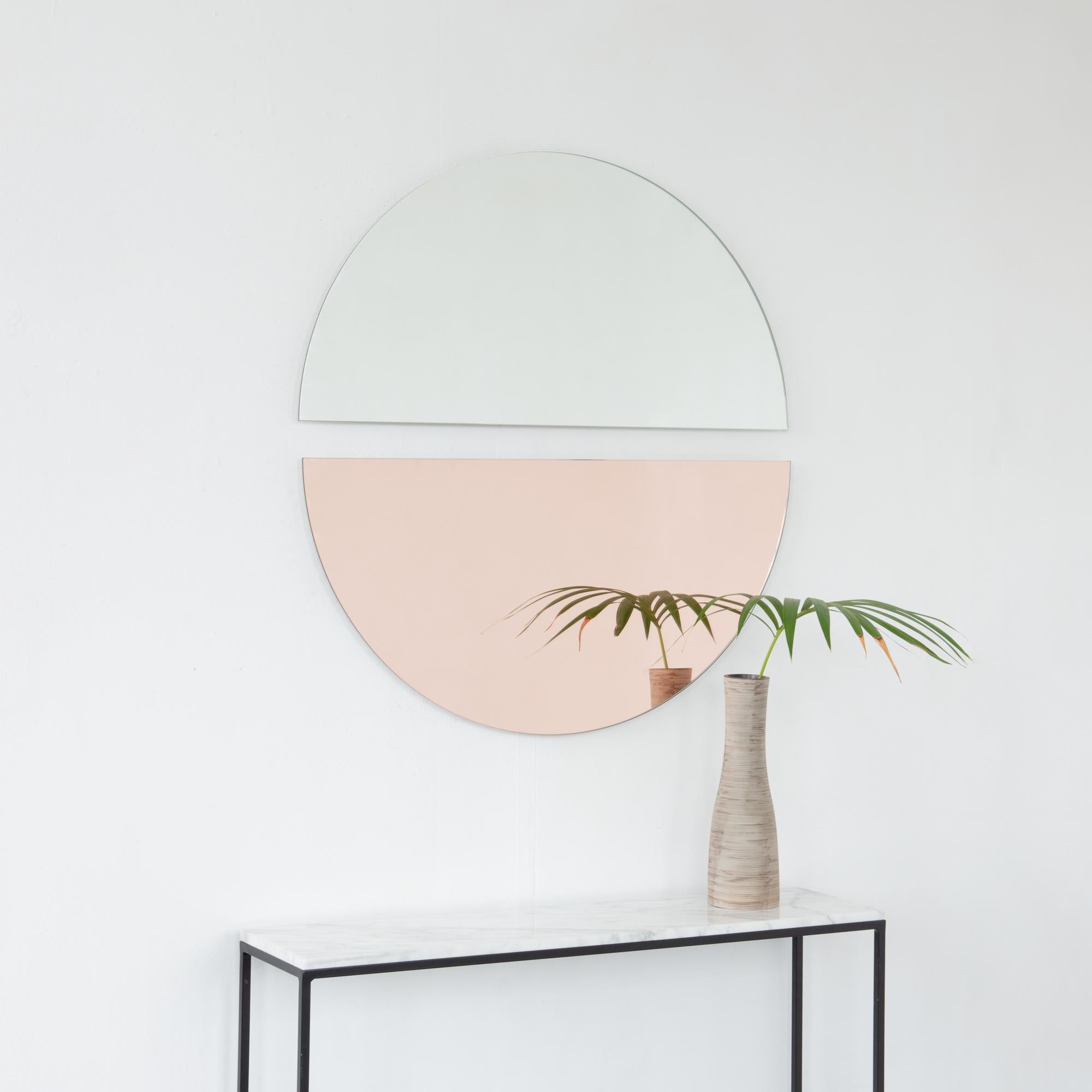 Set of two charming and minimalist rose gold (peach) and standard silver half-moon Luna™ frameless mirrors with a floating effect. Fitted with a quality and ingenious hanging system for a flexible installation in 4 different directions. Designed and