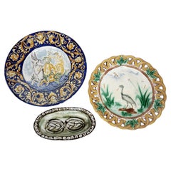 Set of 2 majolica plates, early 20th century and an earthenware dish, France