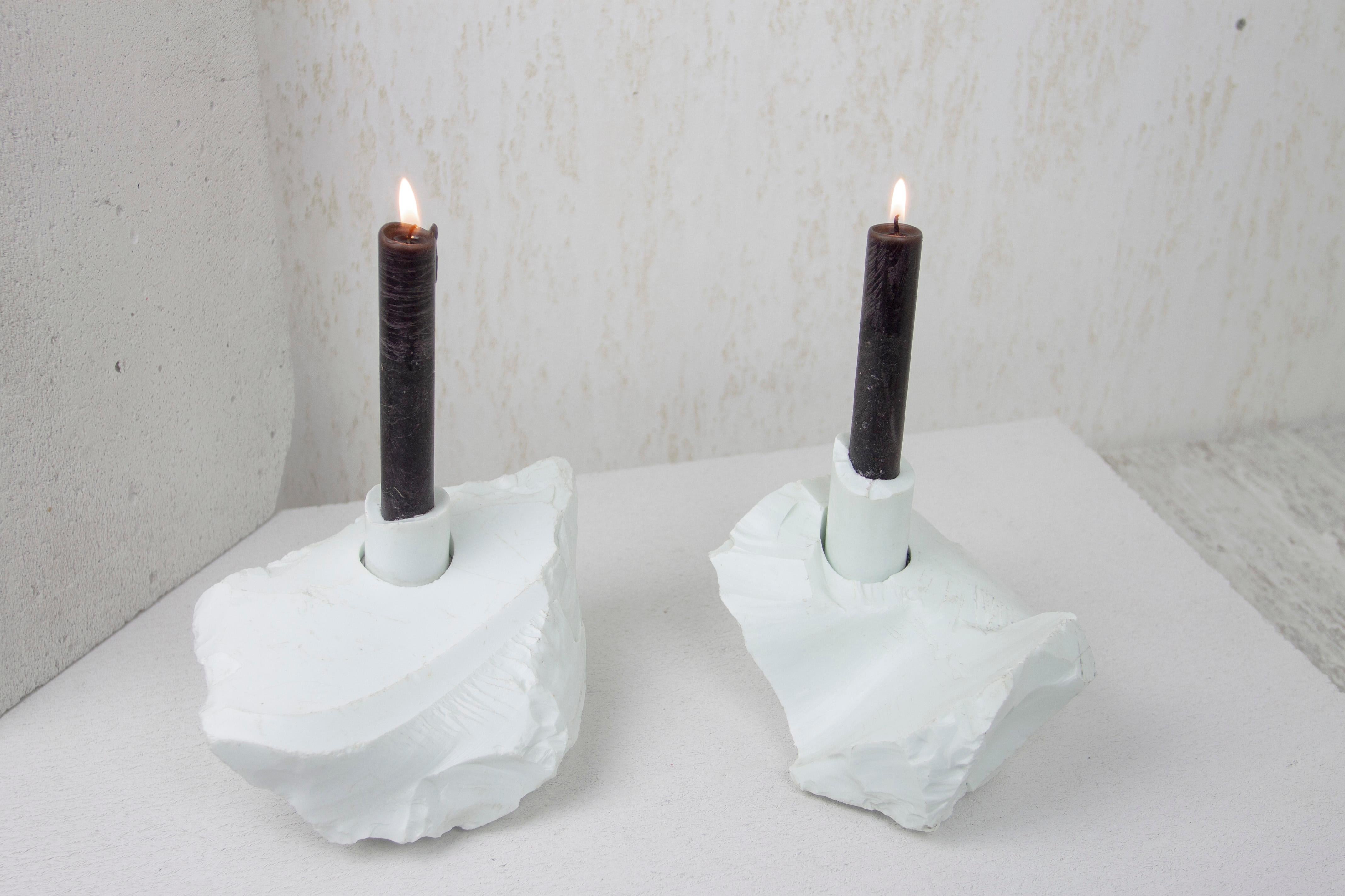 Set of 2 Manmade Porcellanite Abra Candelabra by Studio DO
Dimensions: D 20 x W 13 x H 9.5 cm / D 16 x W 12 x H 11.5 cm
Materials: Manmade porcellanite, aluminum.
8.4 kg.

Stone and fire are connected in an ageless bond. A sparkle created by
