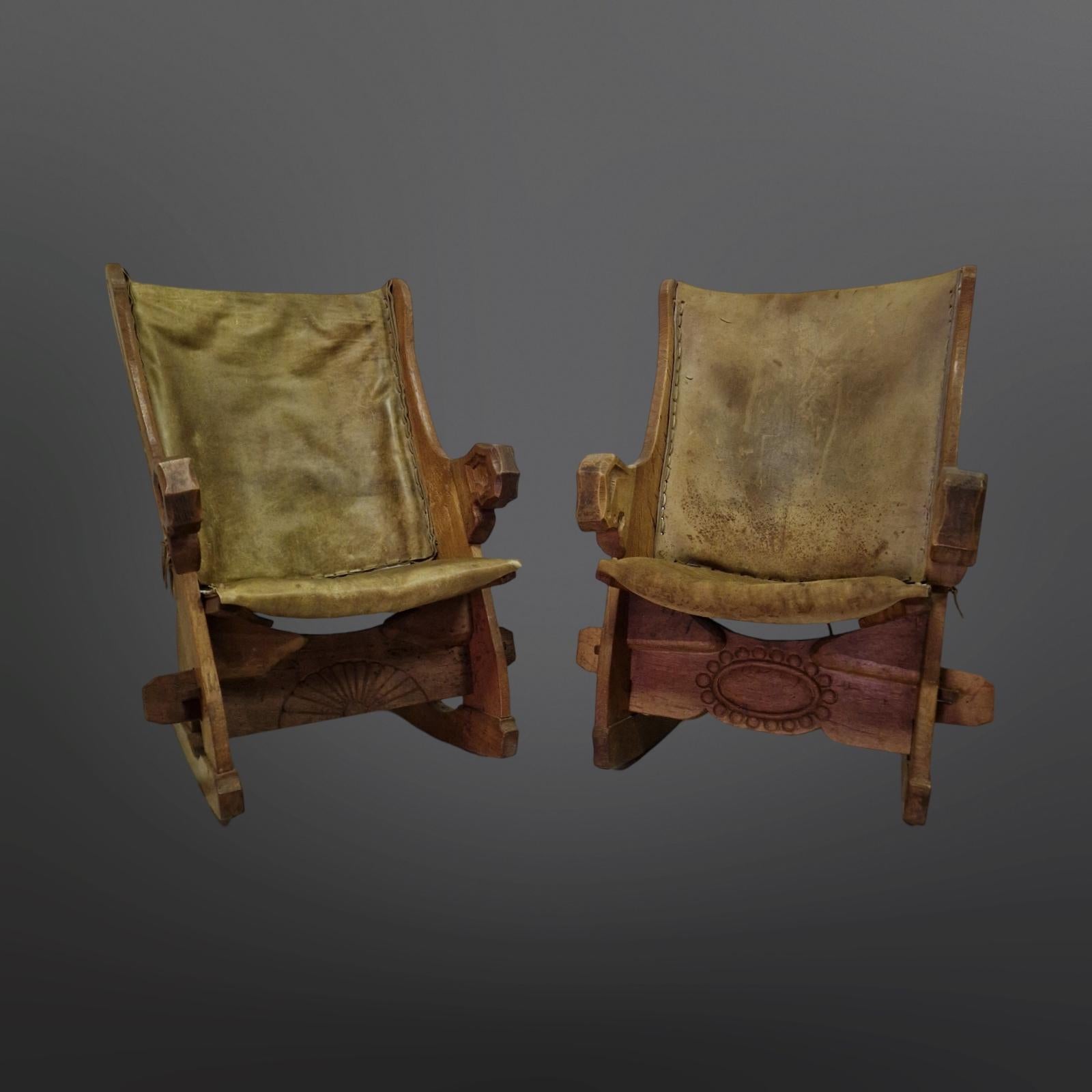 Set of 2 brutalist rocking chairs. Made from solid oak. The seat is fixed to the frame with hand-carved wooden pegs. The back is fixed to the frame with leather laces. Hand made without the use of any screws. 
Both chairs are in good condition. The