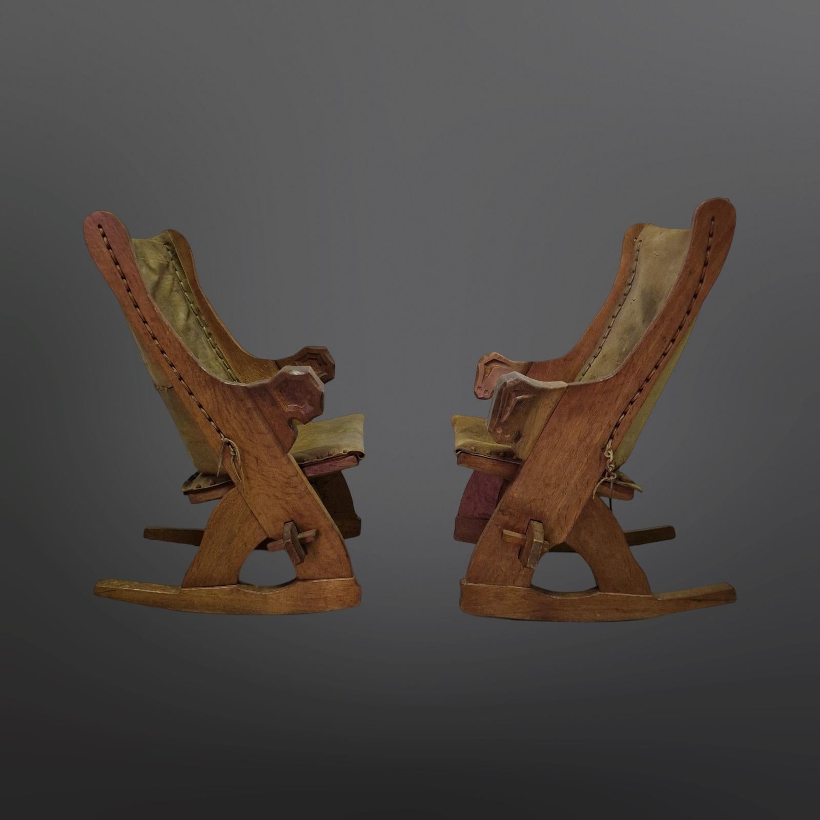 Dutch Set of 2 medieval style rocking chairs in oak and leather, Netherlands 1960s