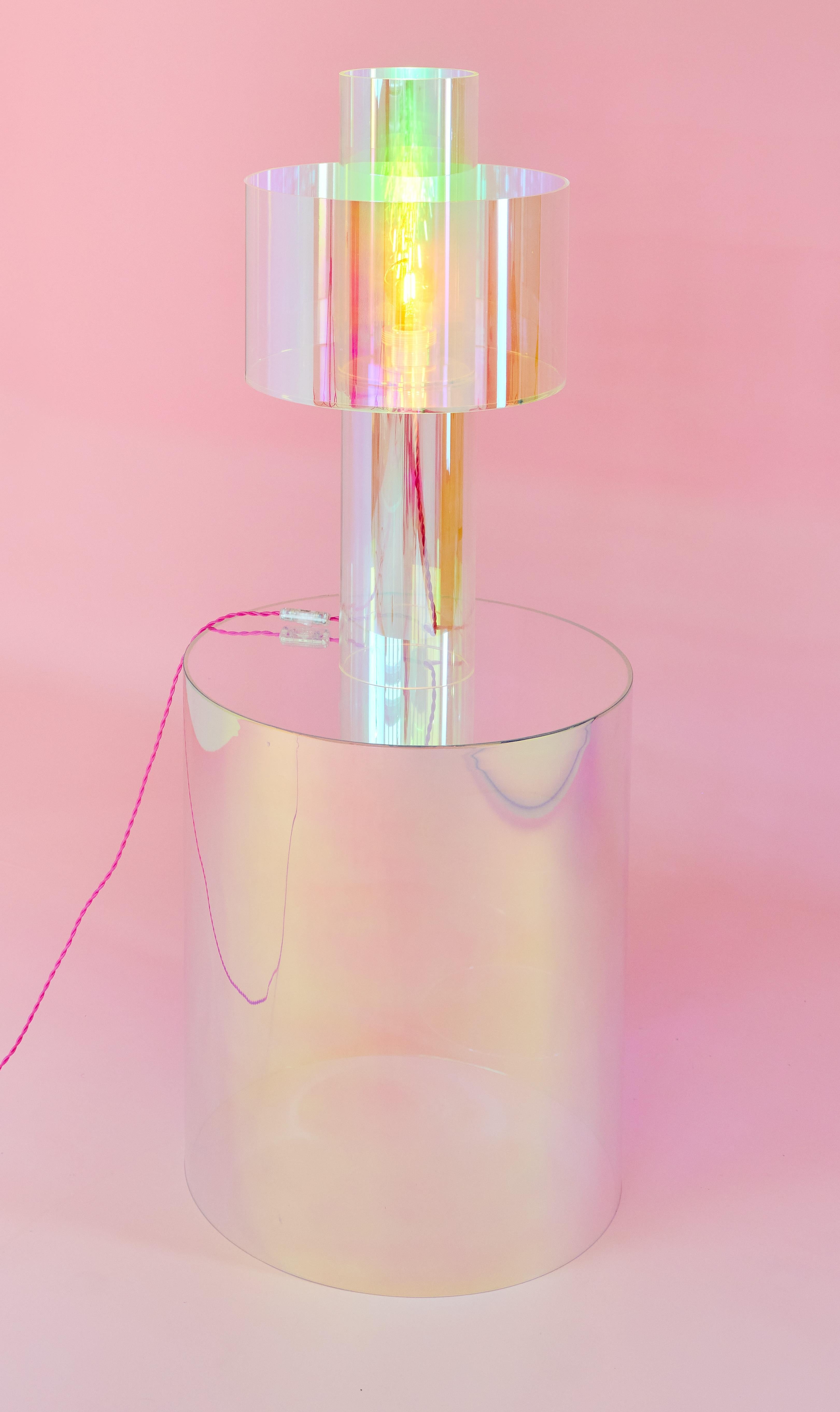 Set of 2 Miami Pink Floating Table Lamp and Tube Side Table by Brajak Vitberg
Materials: Plexiglass and dichroic film.
Dimensions: Table Lamp: Ø 35 x H 44 cm.
Side Table: Ø 50 x H 60 cm. 

The table lamp available with lampshade in pink/blue