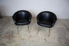 Set of 2 black faux leather Mid-century armchairs