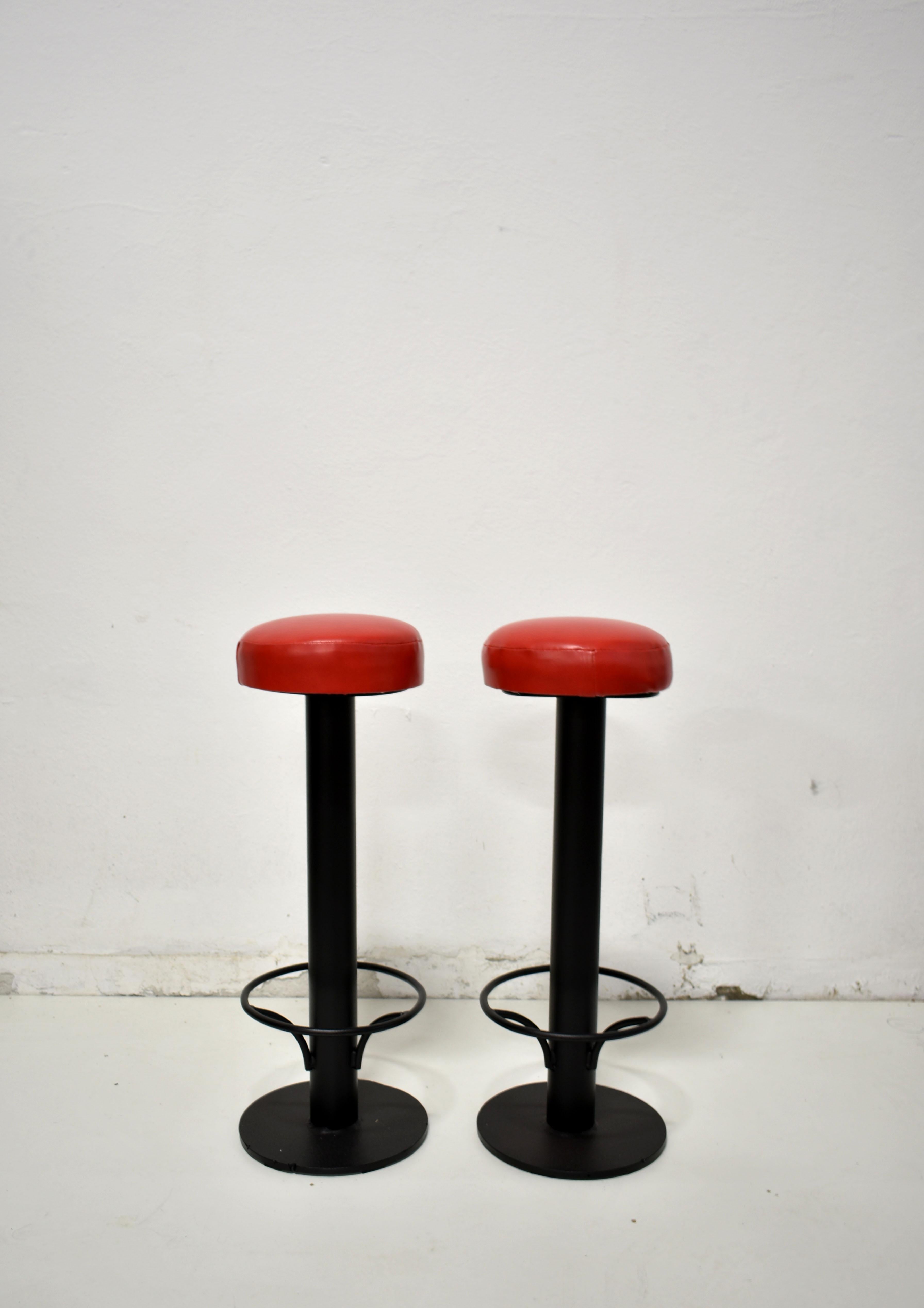 Set of two renovated bar stools
The heavy metal stand is powder-coated in black, and round-shaped seats have been reupholstered in red vinyl

The stools are from the 1960s, but due to renovation, they look almost as new. 

Some photos show four