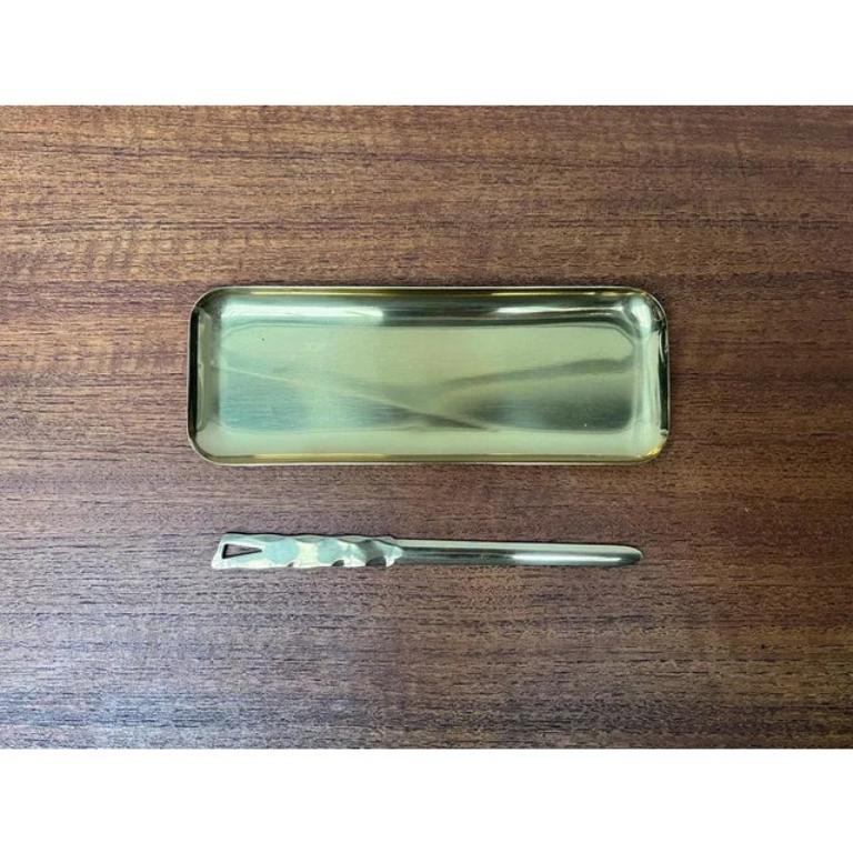 Mid-Century Brass Desk Tray and Letter Opener, 1950s, Set of 2, in Very Good conditions. Designed 1950 to 1959.

Additional information:
Materials: Metal
Color: Gold
Styles: Mid-Century Modern
Item Type: Vintage, Antique or Pre-owned
Dimensions: