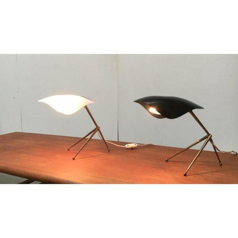 Rare mid-century table lamps from Cosack.

Filigree design with a special combination of materials. Three feet come together at one point on the shaft to form a tripod. The rods are conical in shape and finished with balls at the bottom. The