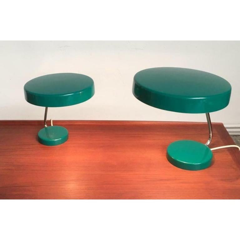 6658 table lamps by kaiser glow in a rare color. what is special here is the combination of 2 lights of the same type and color in different sizes.

A minimalist design by kaiser. The lamp convinces with its simple design language. The coloring in