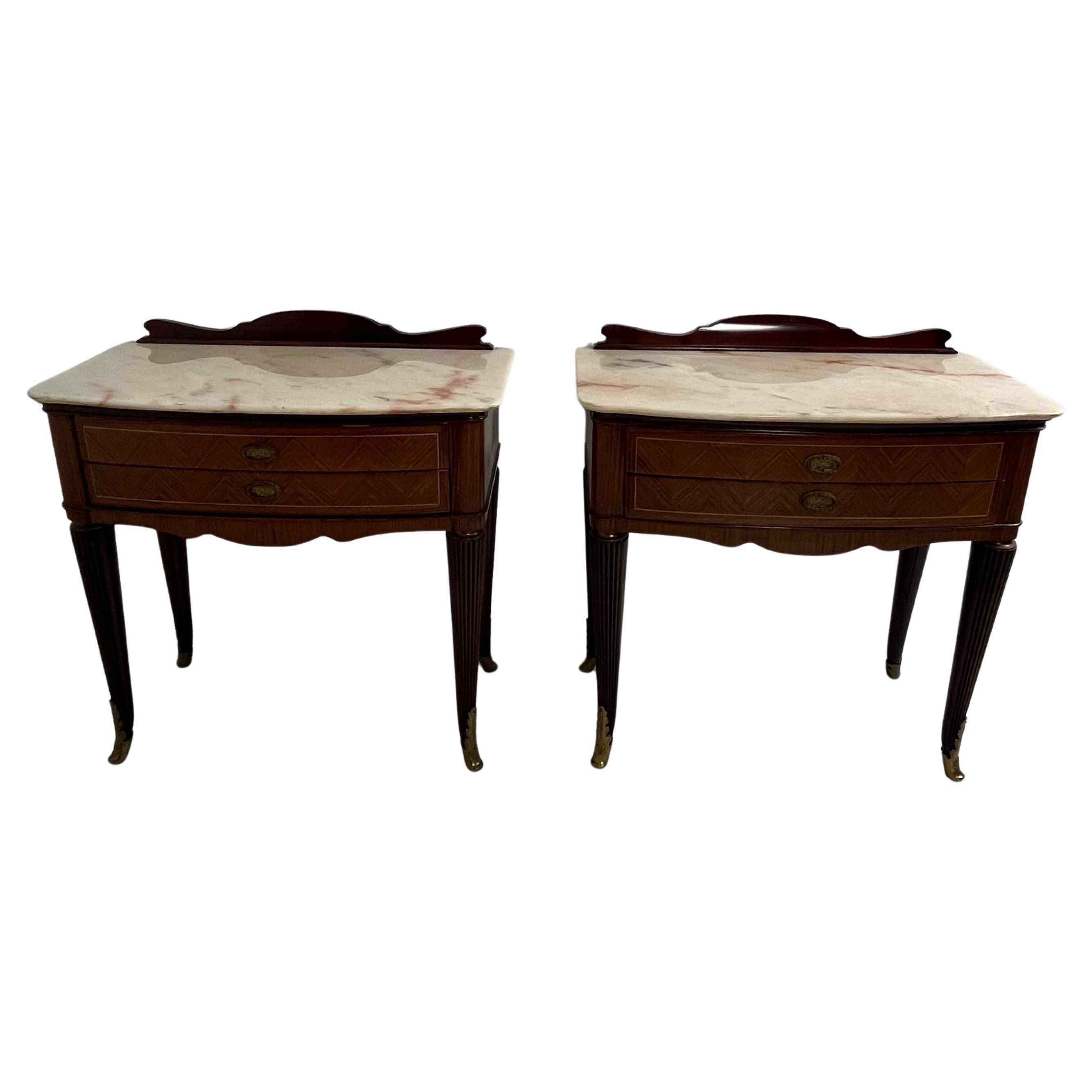Set of 2 mid-century Italian nightstands, 1950s
Intact and in good condition.
Brass legs, marble top. Two drawers on the front.
Discovered in a noble apartment in my hometown, Palermo.

We guarantee prompt shipping with suitable packaging in a