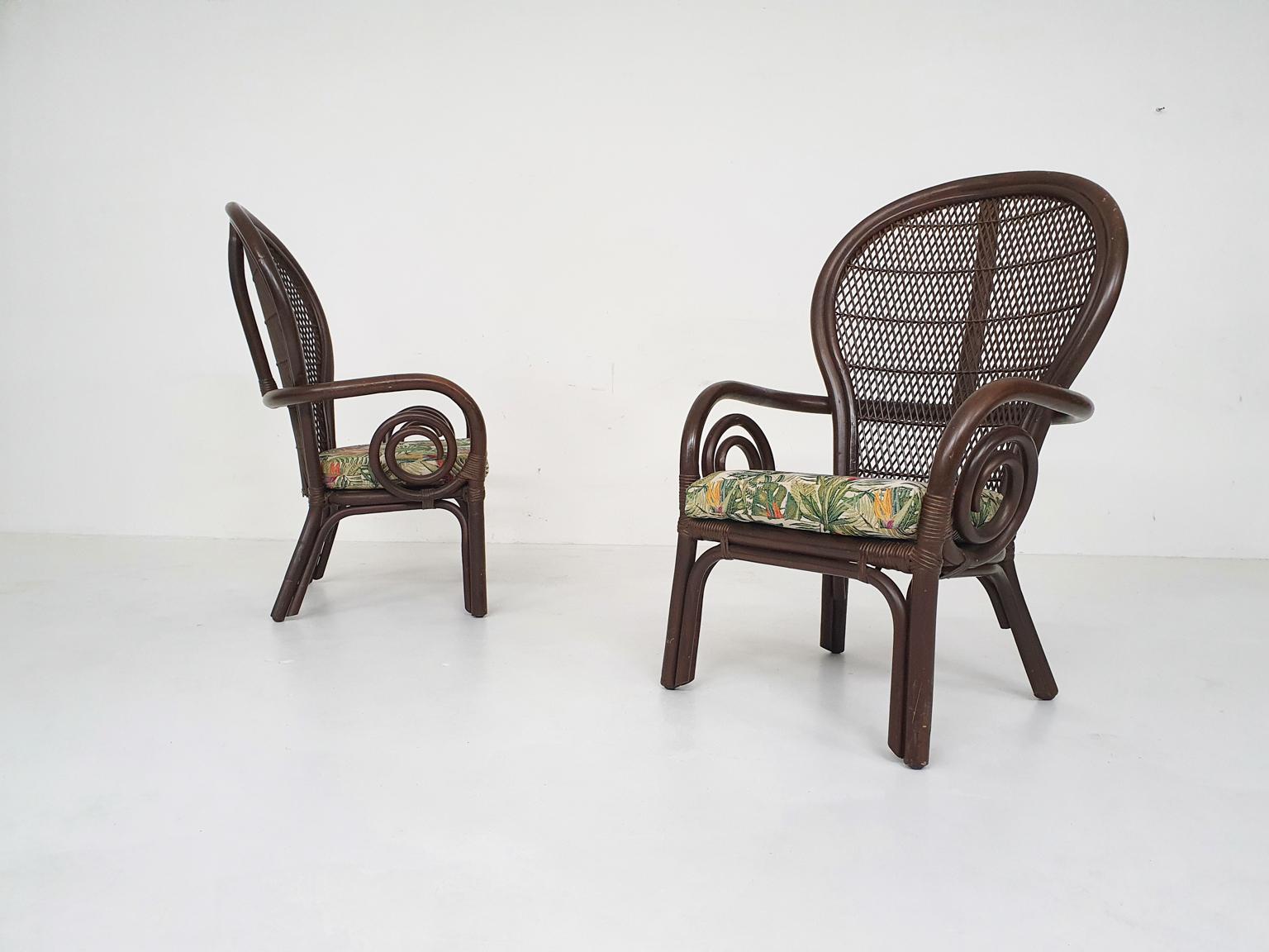 Midcentury dark brown manou lounge chairs. The seating cushions have new upholstery with a botanical flower pattern. Very nice for in your orangery, on your porch or for outdoor.