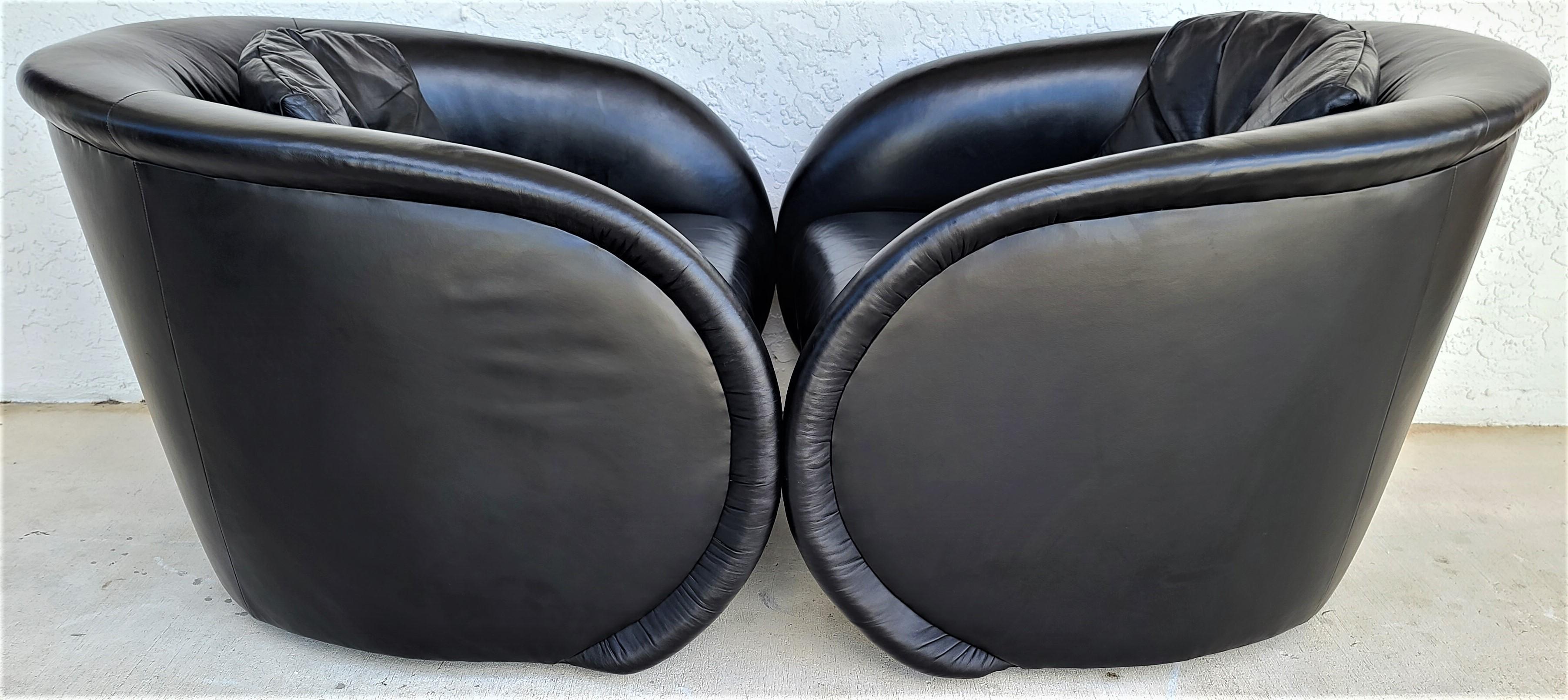 Offering One Of Our Recent Palm Beach Estate Fine Furniture Acquisitions Of A
Set of 2 Mid-Century Modern black leather swivel Barrel lounge chairs by Preview
Spectacularly designed chairs with a style that will never go out of fashion and made of
