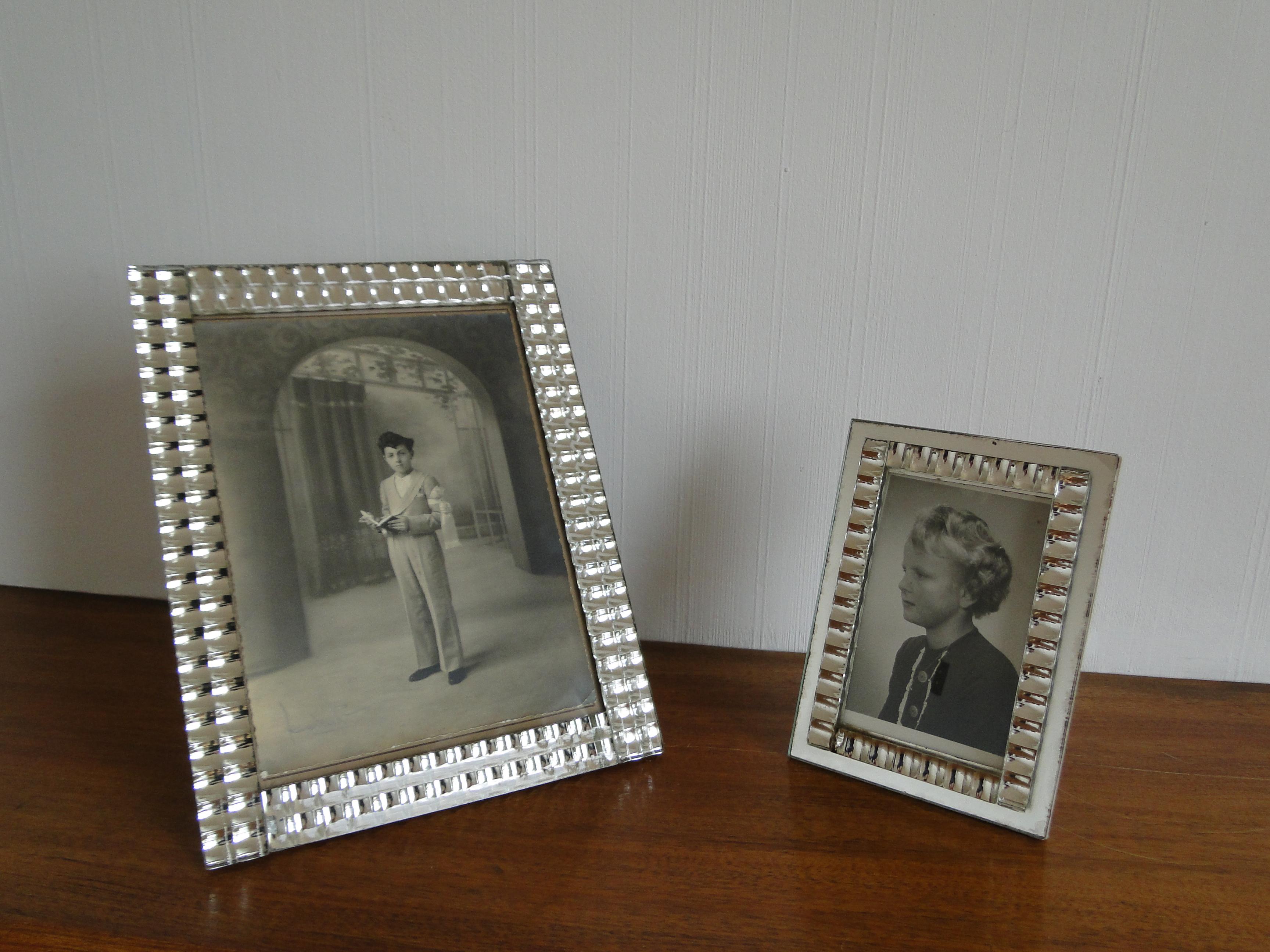 2 Mid-Century Modern style mirror photo frames. The sides are beautifully constructed with tiny square domed mirrors with a metallic Kinetic effect. 
The large frame can be placed in portrait or landscape position. Original paper easel and back.