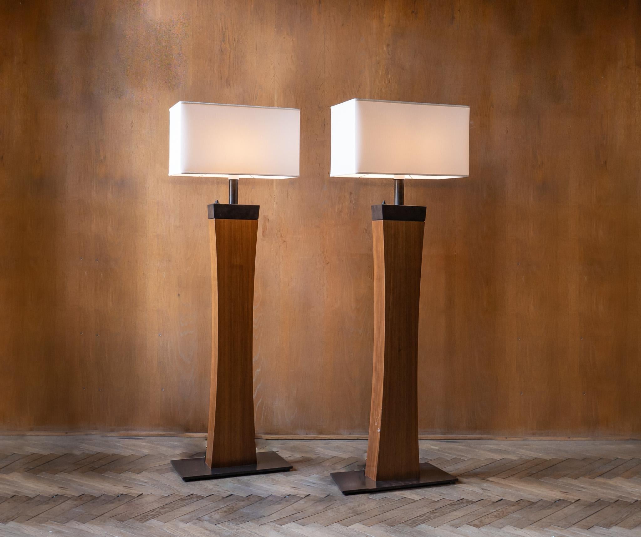 Set of 2 Mid-Century Modern Wooden Italian Floor Lamps, Italy 1970s.

This set of 2 Mid-Century Modern Italian floor lamps were produced in the late 1970s.
These lamps feature a sleek and stylish design with a wooden and metal base that provides