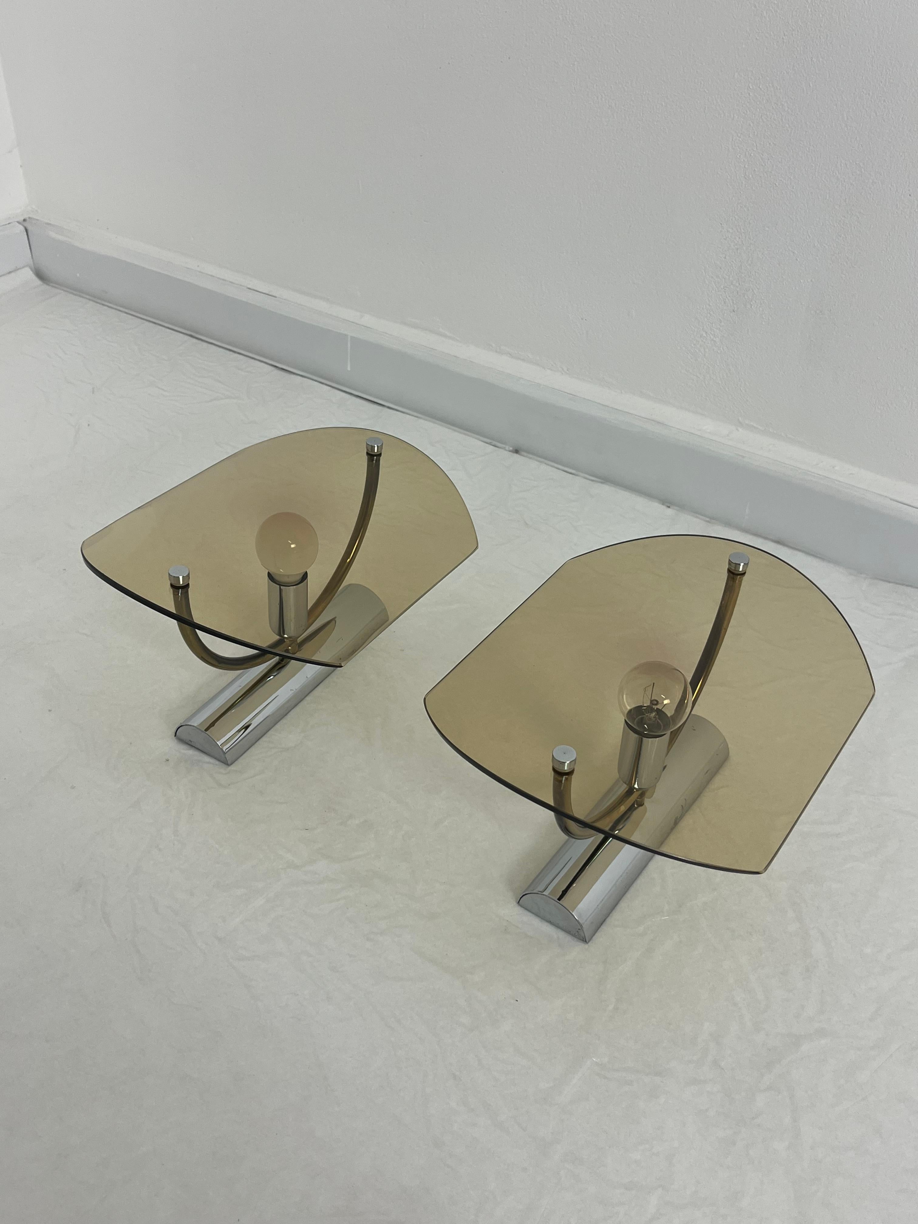 Set of 2 mid-century smoked glass wall lamps, 1960s
Metal and brass frame.
E14 lamps.
Good condition.


A similar chandelier is currently available in another listing.