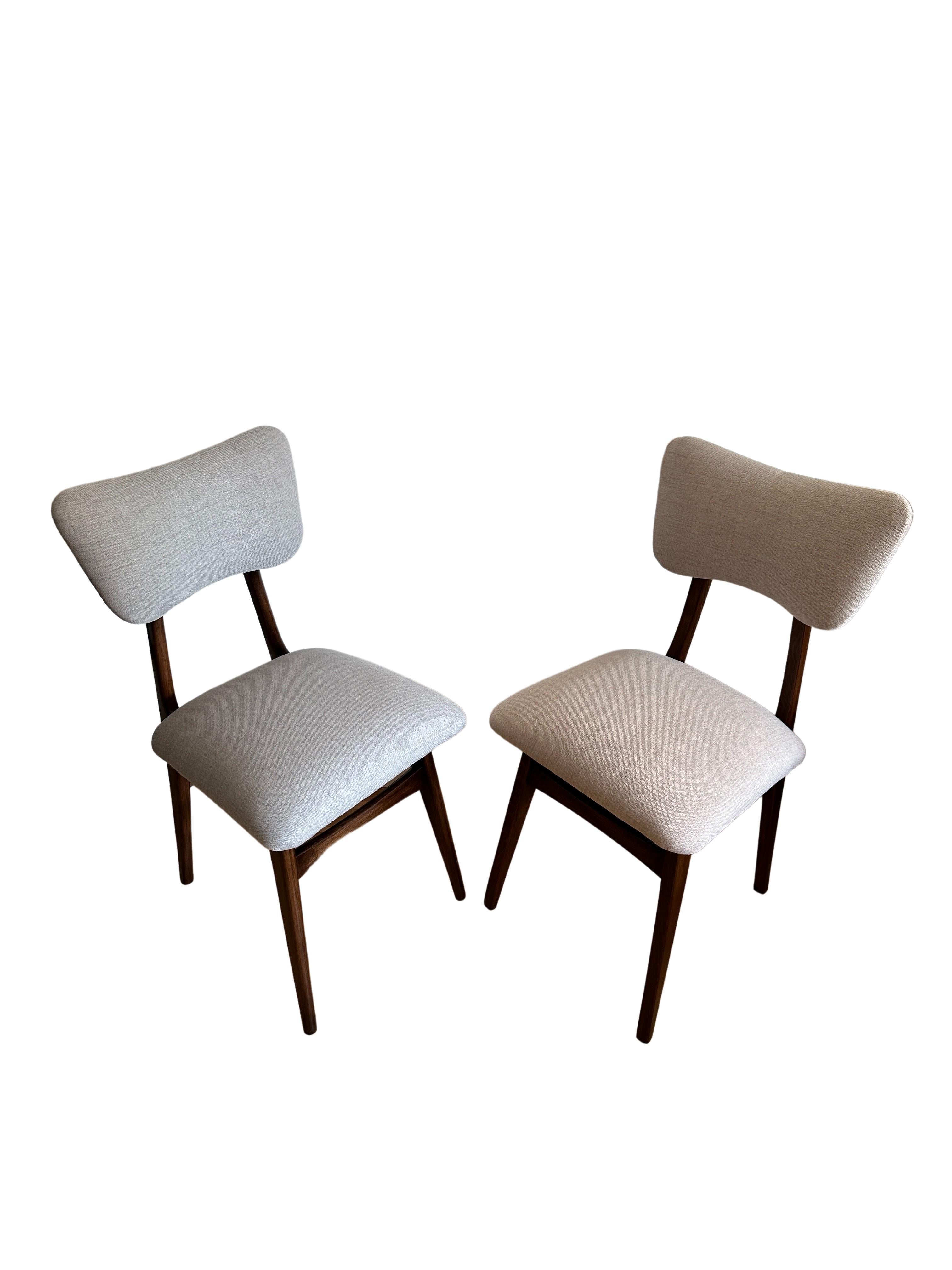 Unique set of two chairs manufactured in Poland in the 1960s, designed by Rajmund Halas. 

The upholstery is made of fabric with an interesting structure of thickly woven canvas, nice and soft to the touch. The fabric is covered with a protective