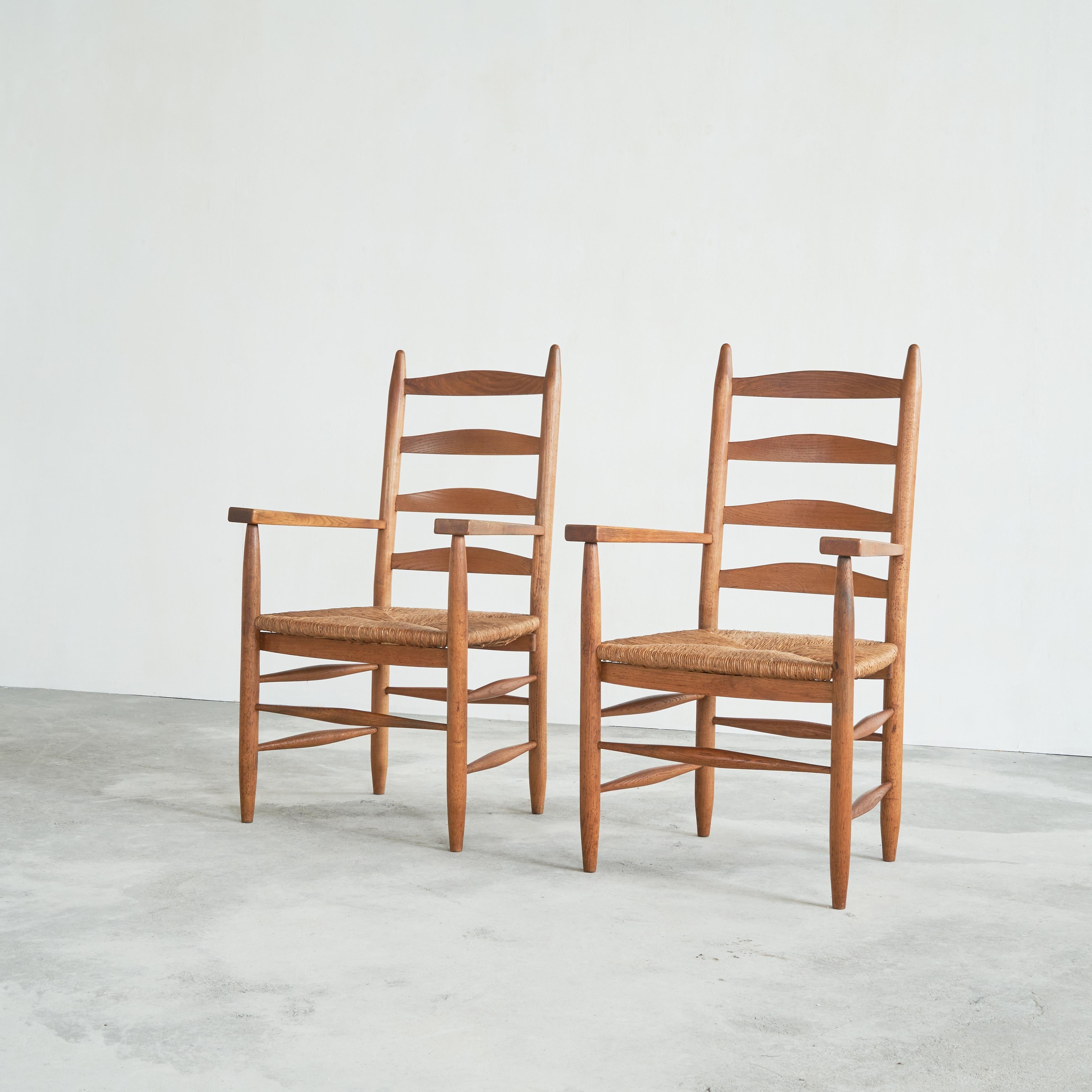 Set of 2 Mid Century Oak and Rush Armchairs, Europe, 1950s. 

A rare and wonderful set of 2 armchairs in solid oak with rush seats. These chairs are the pinnacle of untouched mid Century Furniture. Beautiful and sturdy oak, combined with rush seats