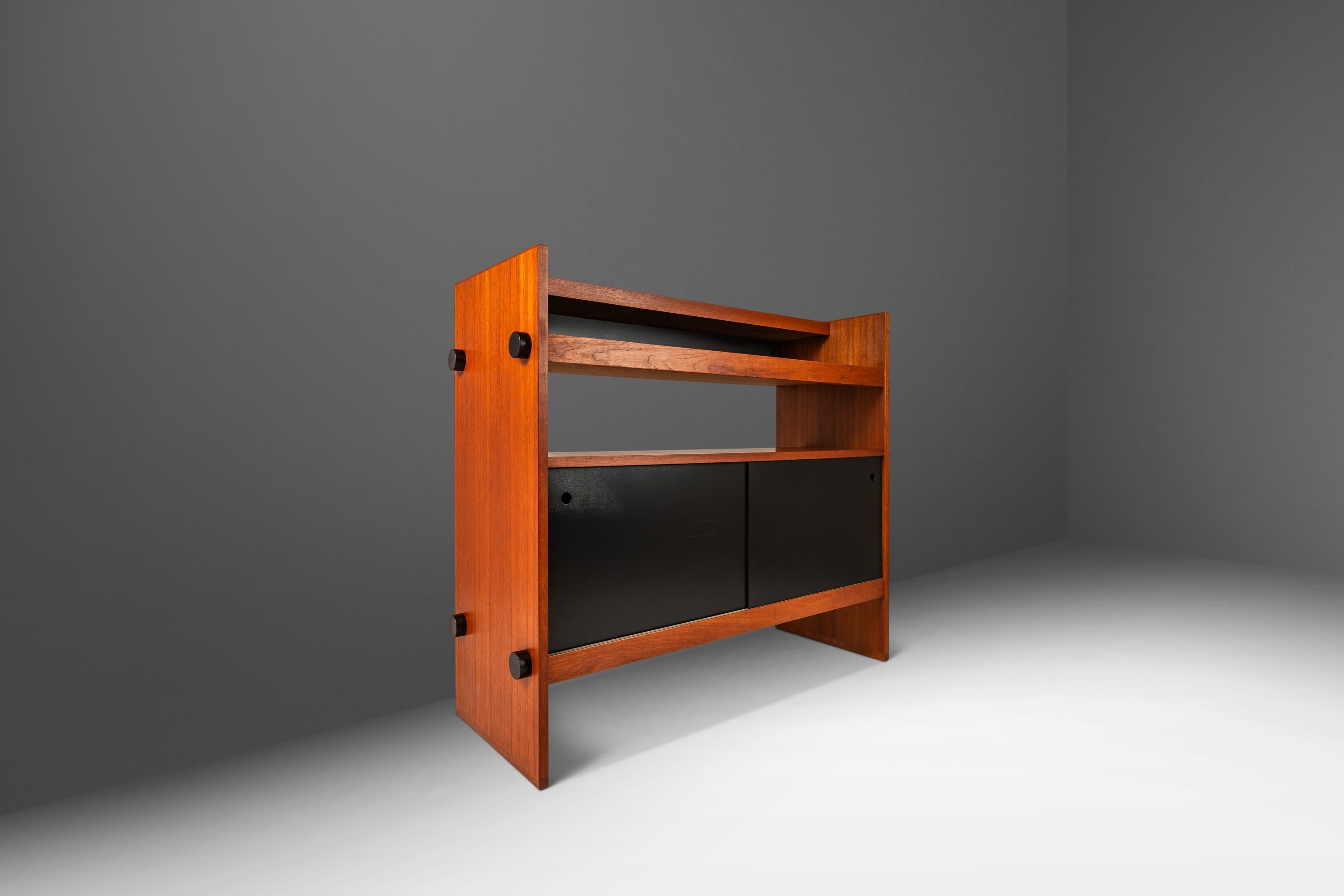  Introducing an exceptionally rare set of two matching Danish-made dry-bars with ultra-minimalist lines and stances. These petite bars are the epitome of functional art and the perfect example of what two contrasting tones can do in a single piece