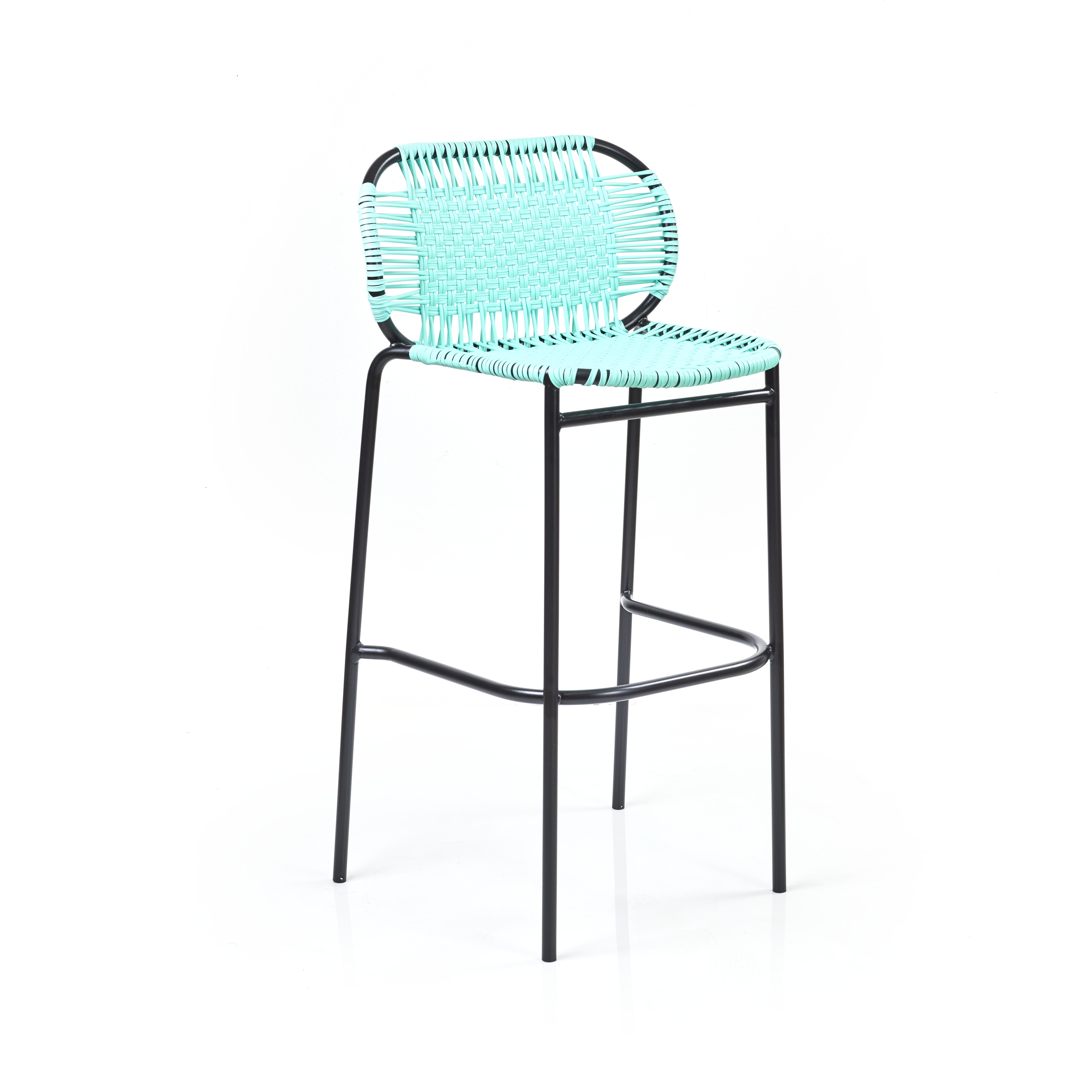 Set of 2 Mint Cielo bar stool by Sebastian Herkner
Materials: Galvanized and powder-coated tubular steel. PVC strings are made from recycled plastic.
Technique: Made from recycled plastic and weaved by local craftspeople in Cartagena, Colombia.