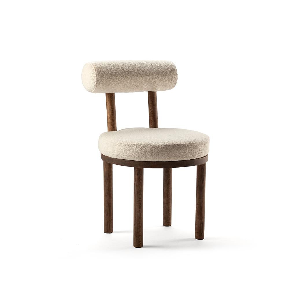 Set of 2 Moca chair by Collector
Materials: Solid oak wood structure. Uphostered in Boucle fabric.
Dimensions: W 51 x D 53 x H 86 cm
SH 49 cm 

A chair that mixes both modern and classical design approaches.
Designed to hug the body, durable and