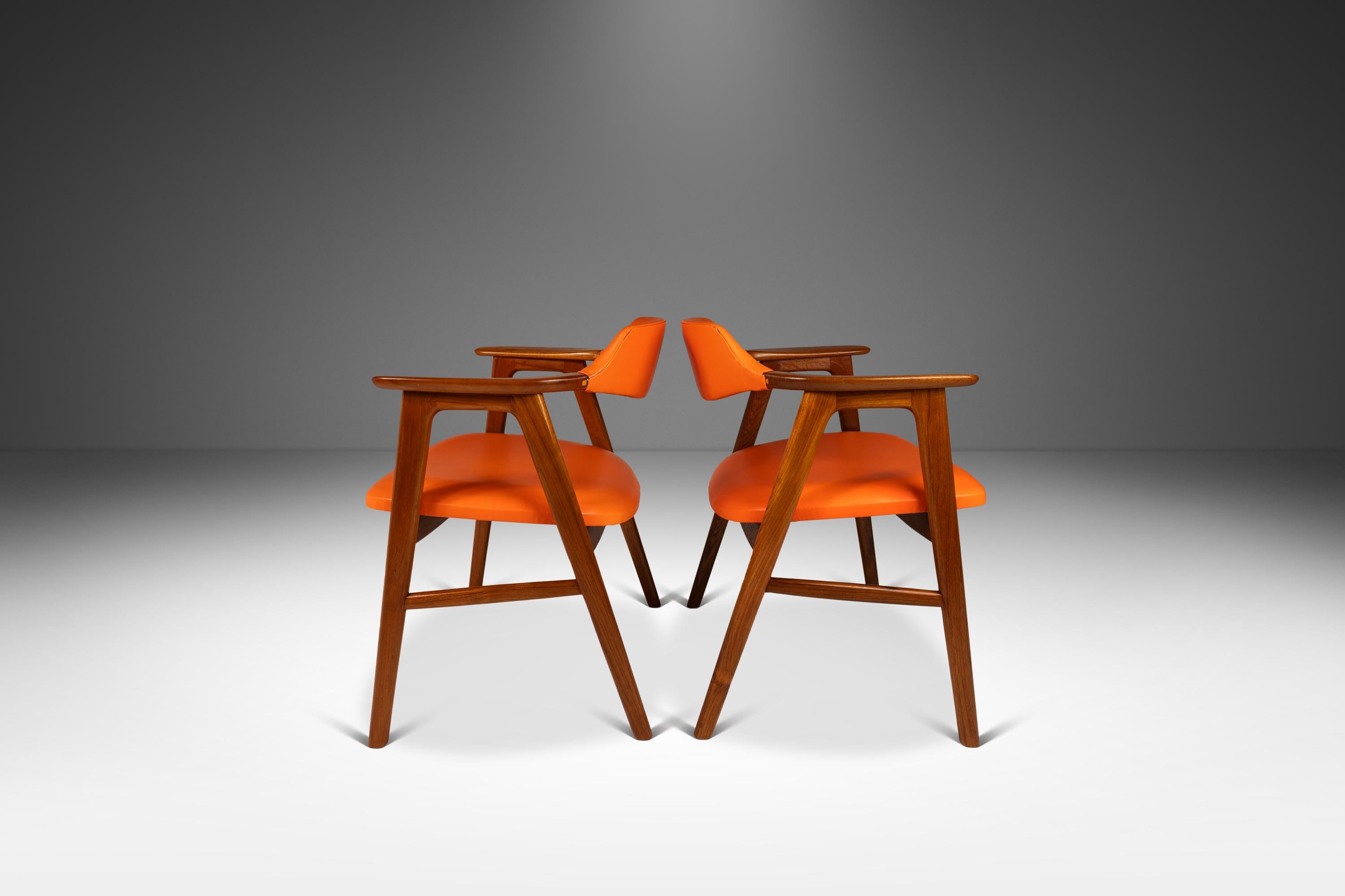 Introducing a set of rare, early Model 42 armchairs designed by the influential Erik Kirkegaard for Høng Stolefabrik. Recently restored and featuring newly upholstered in a stylish orange vinyl this now iconic armchair set is perfect for designers