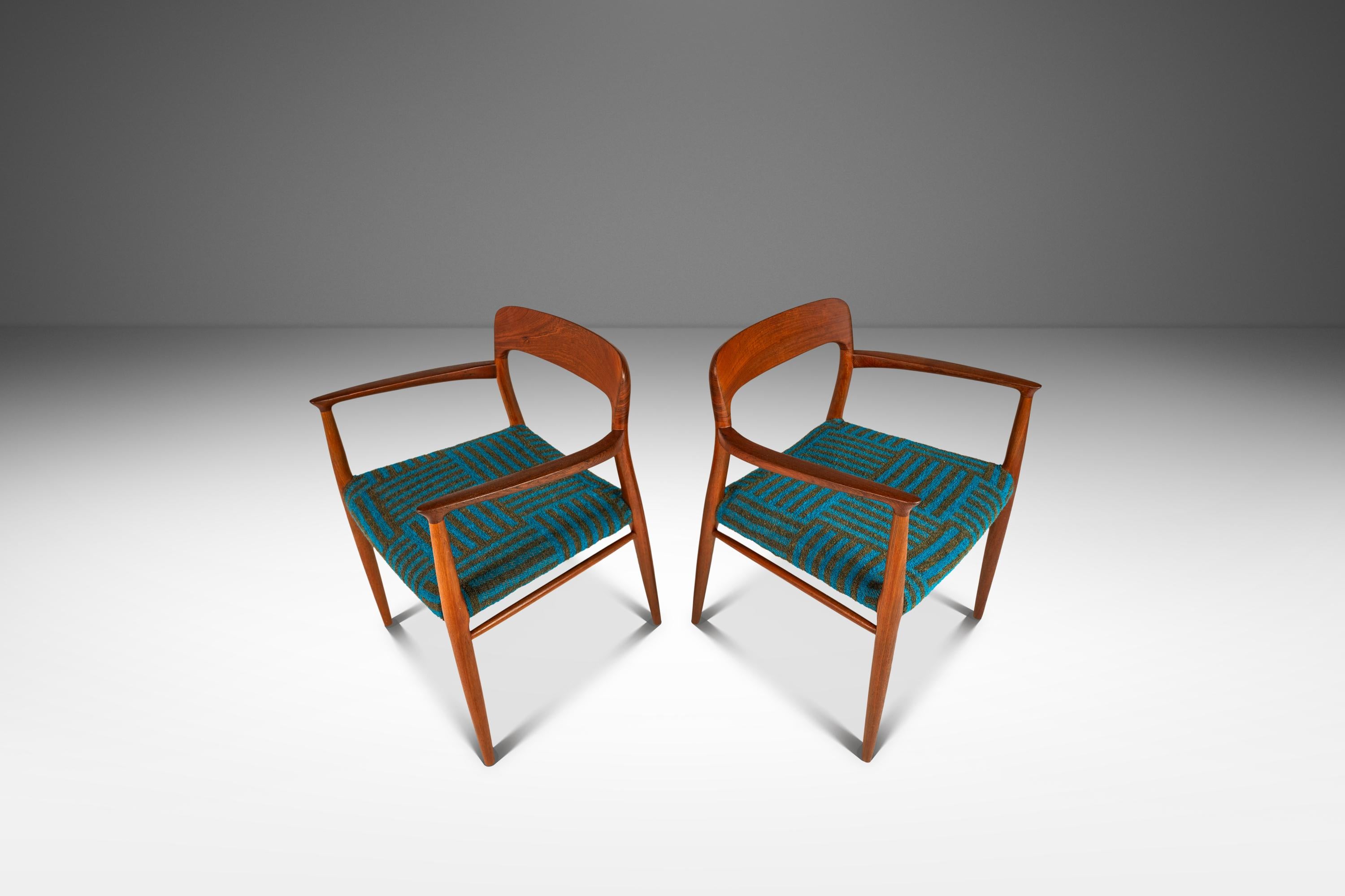 Introducing a rare and limited set of two ( 2 ) Model 75 Armchairs by Niels Møller for J.L. Møllers Møbelfabrik, crafted in the 1960s in Denmark. These stunning armchairs are constructed from solid teak, showcasing the natural beauty of the