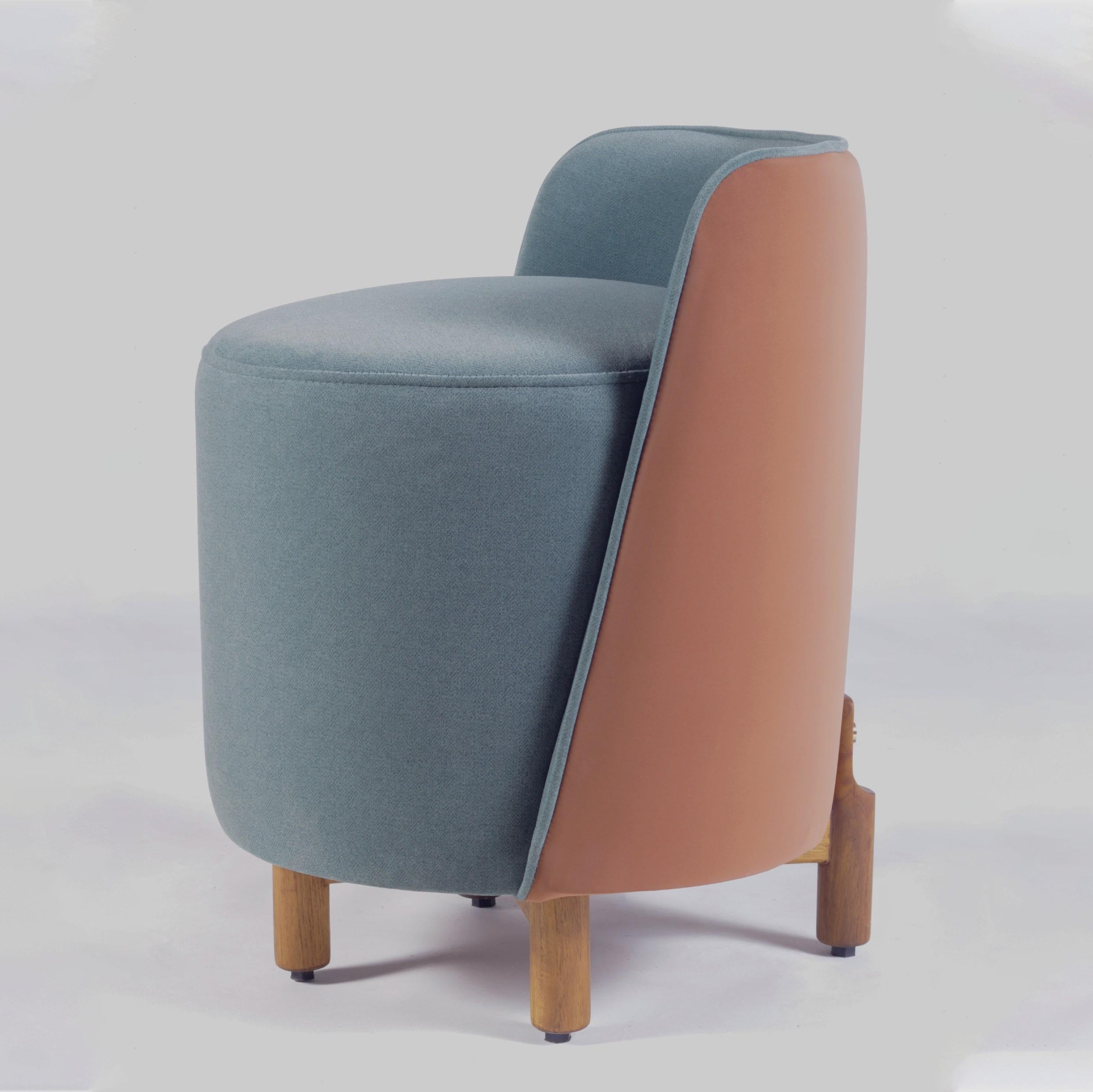 The Minpuff Pouffe is a modern and playful addition to any space. Crafted with solid wood legs, cushioned seat and a backrest, the Minpuff provides a perfect perch for a quick seat or as a footstool. The luscious upholstery creates an interesting