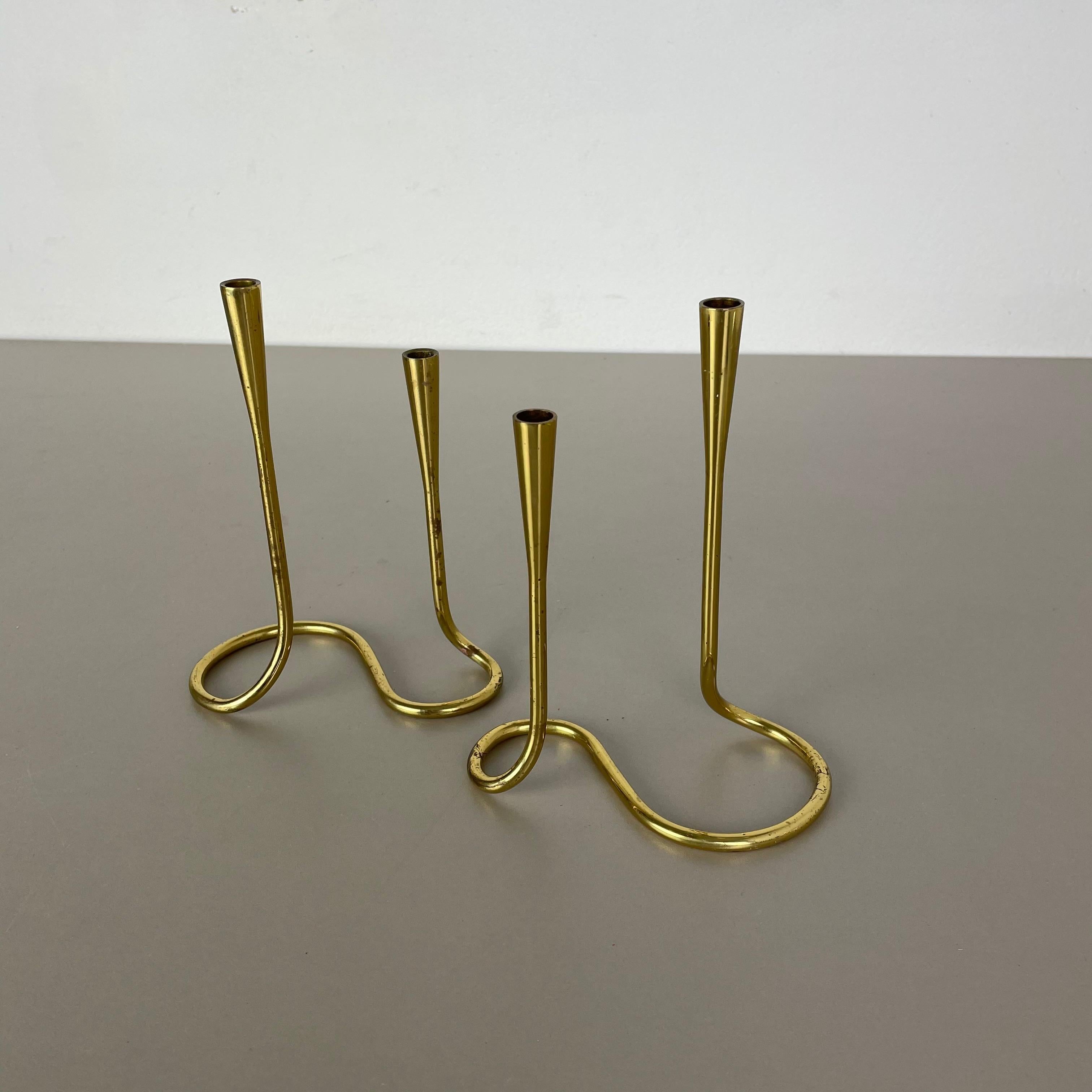 Article:

Sculptural candleholder set of 2


Origin:

Germany (marked on the stand)


Material:

Solid brass


Decade:

1950s




This original vintage candleholder set, was produced in the 1950s in Germany. It is made of solid