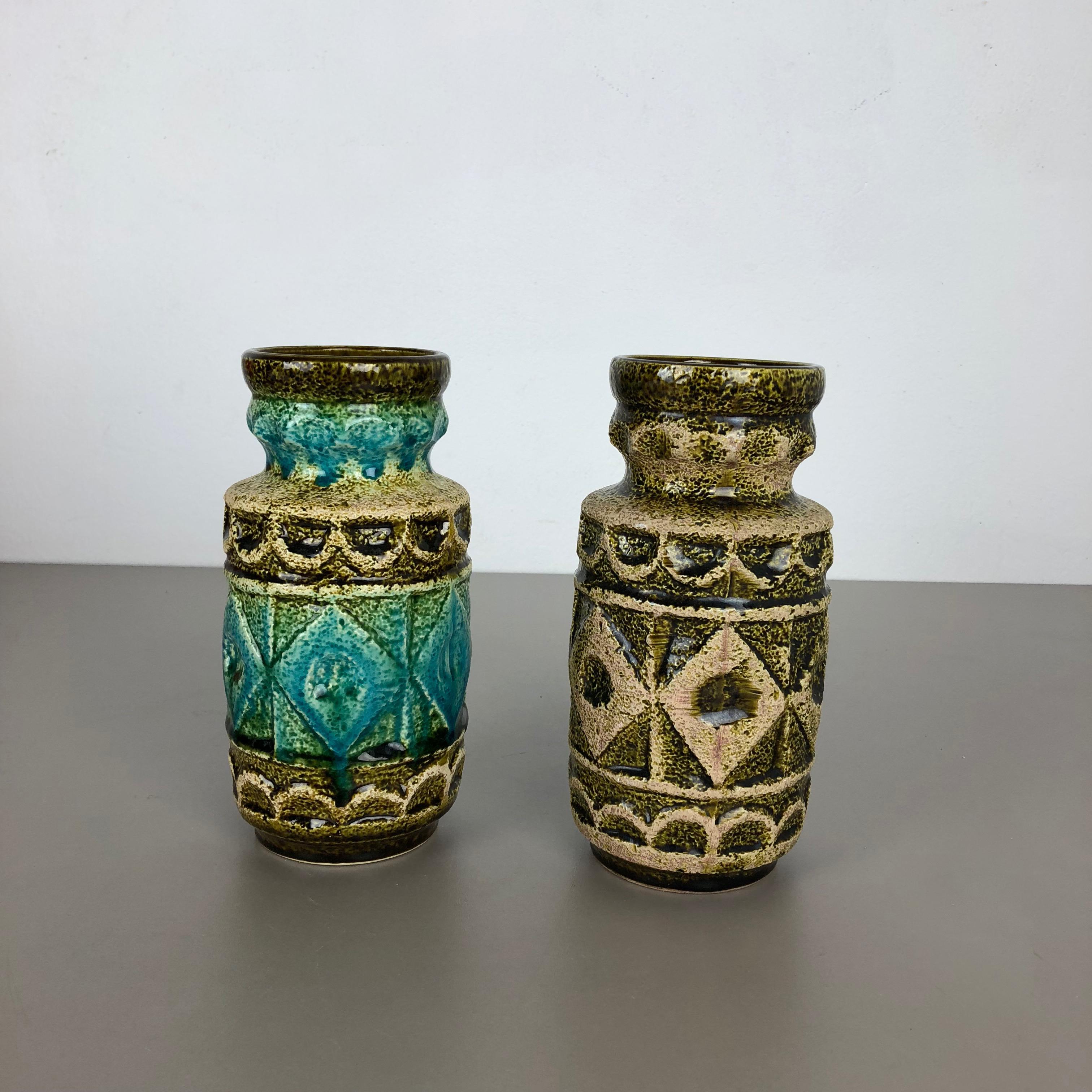 Article:

Pottery ceramic vase set of 2


Producer:

BAY ceramic, Germany


Decade:

1960s



Description:

set of 2 original vintage 1960s pottery ceramic vase made in Germany. High quality German production with a nice abstract illustration and