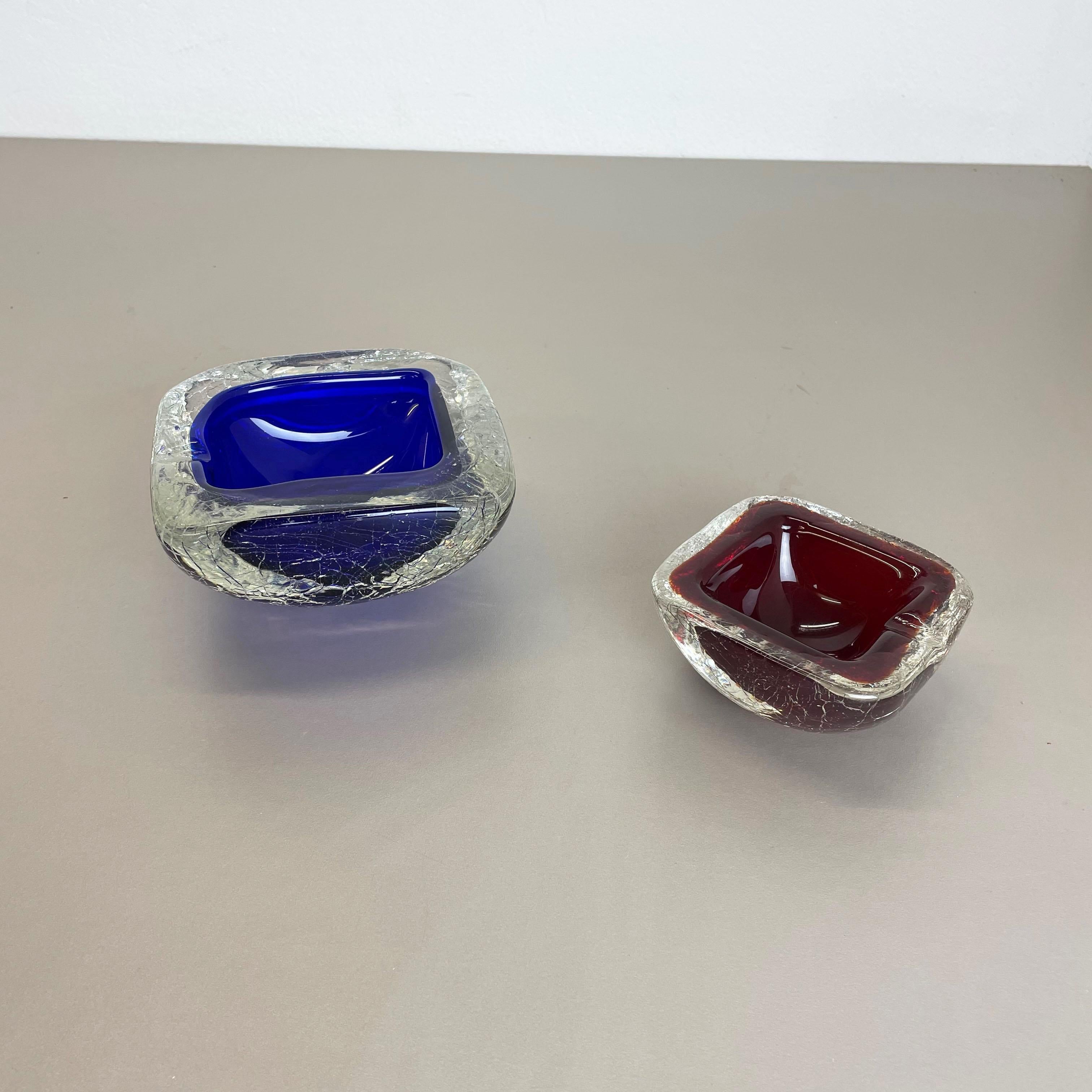 Article:

Murano glass bowl elements set of 2


Origin:

Murano, Italy


Decade:

1970s


These original vintage glass elements were designed and produced in the 1970s in Murano, Italy. It is made in unique crack Technique and has a