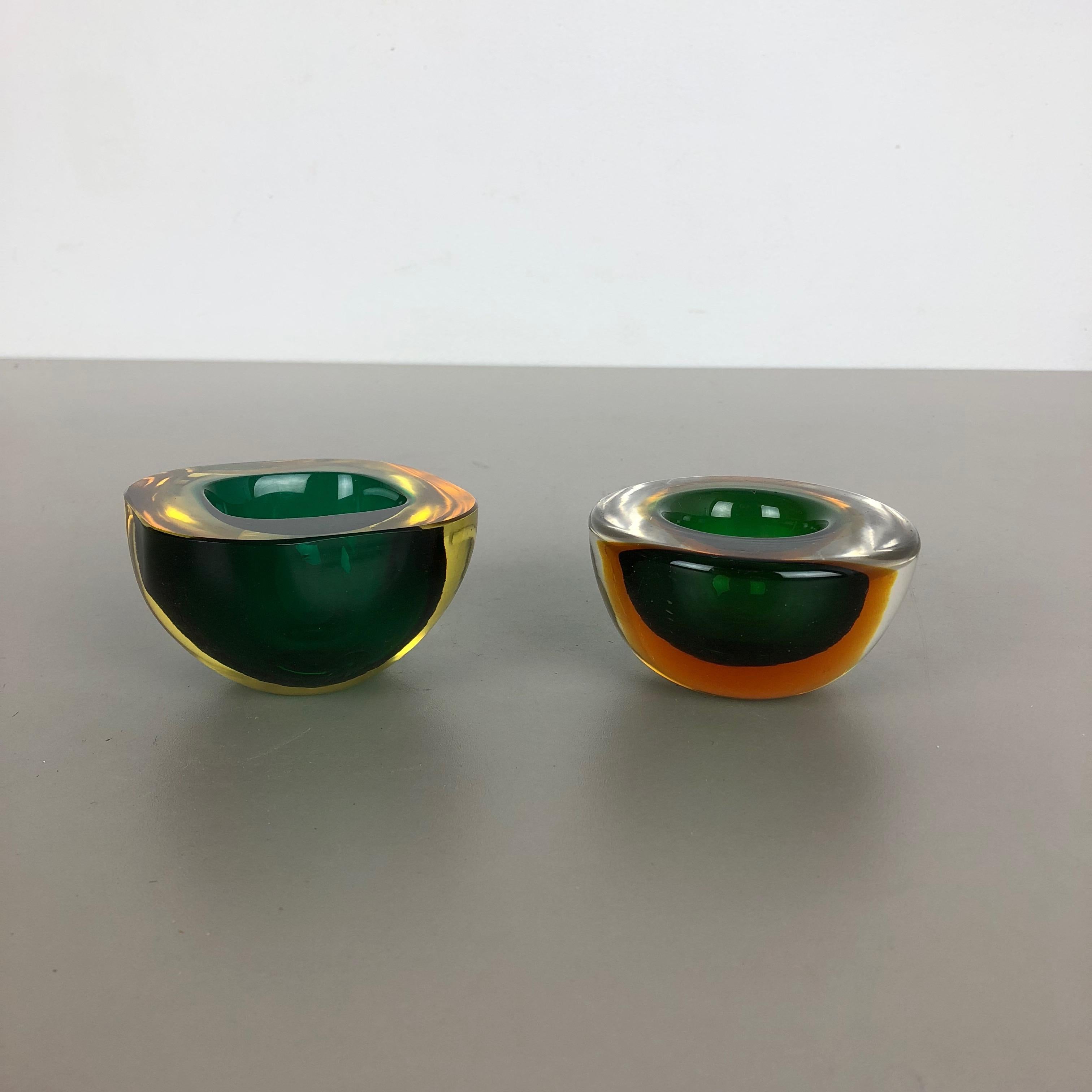 Article:

Murano glass bowl elements


Origin:

Murano, Italy


Decade:

1970s


This original vintage glass element was designed and produced in the 1970s in Murano, Italy. It is made in Sommerso Technique and has a fantastic round form. The