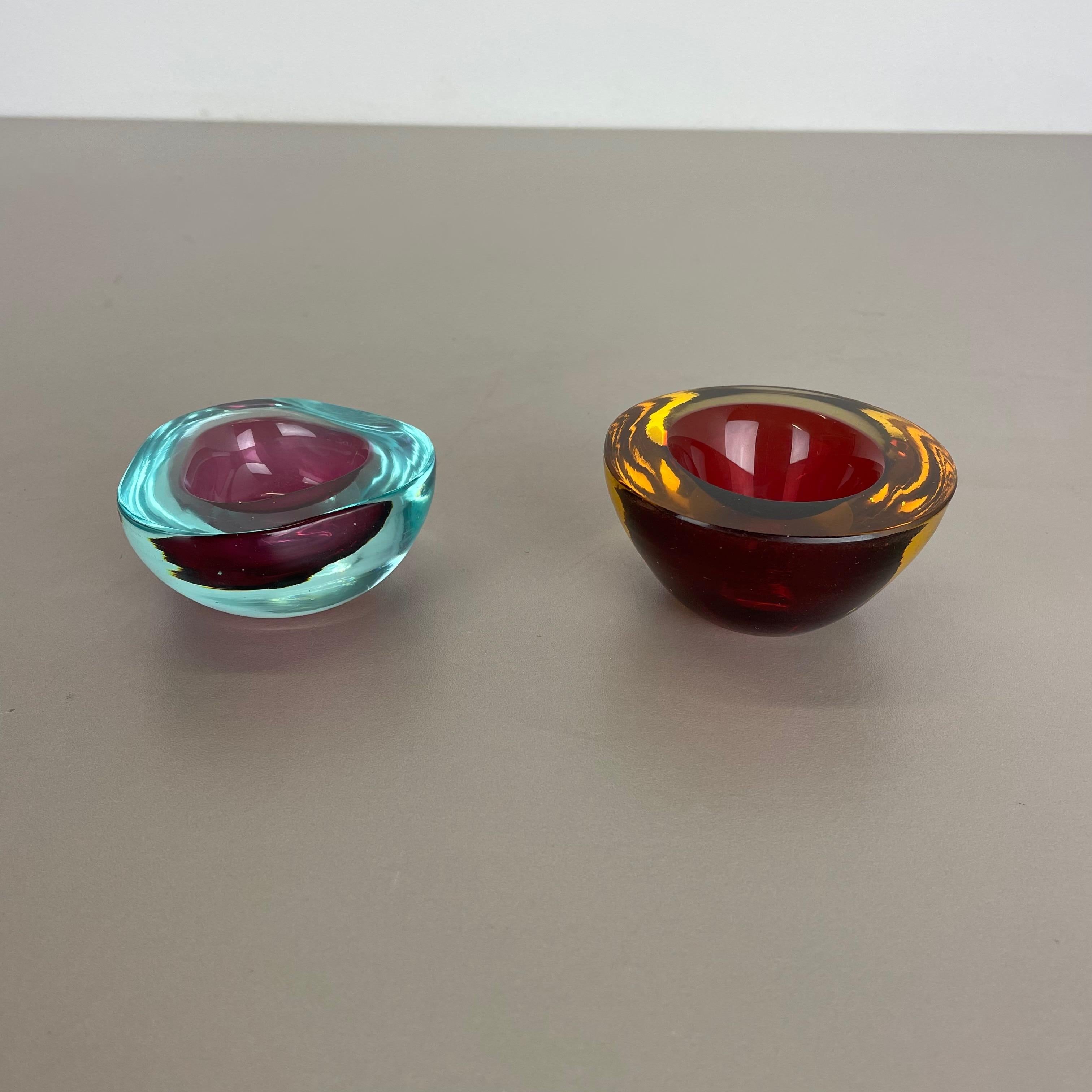 Article:

Murano glass bowl elements, set of 2


Origin:

Murano, Italy


Decade:

1970s


This original vintage glass element set was designed and produced in the 1970s in Murano, Italy. It is made in Sommerso Technique and has a fantastic round