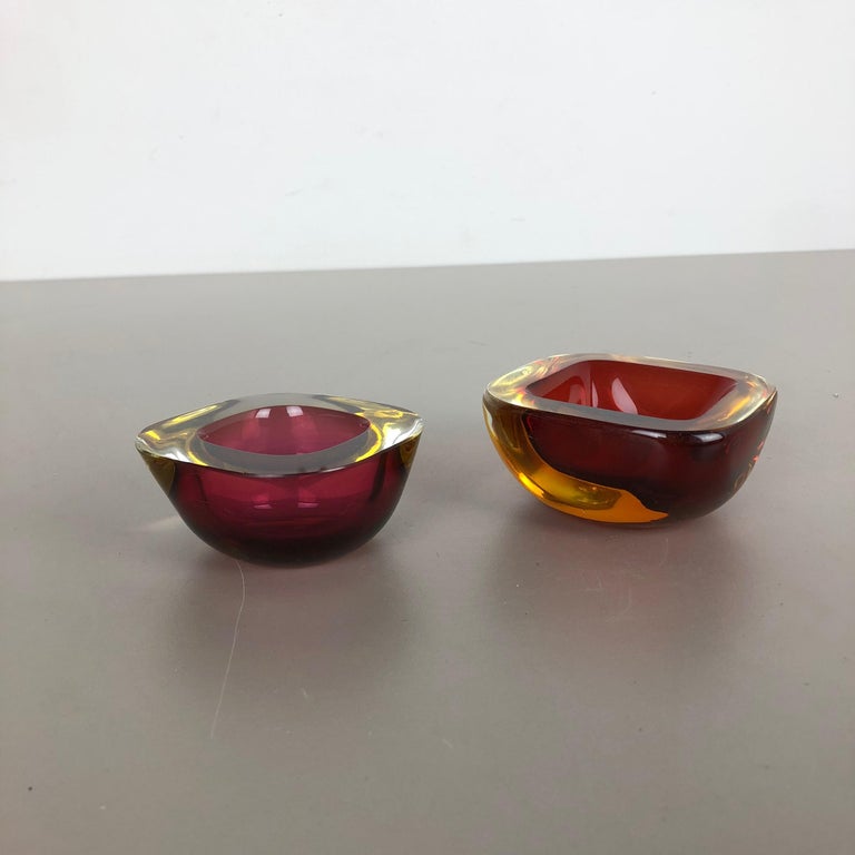 Article:

Murano glass bowl elements set of 2


Origin:

Murano, Italy


Decade:

1970s


This original vintage glass element was designed and produced in the 1970s in Murano, Italy. It is made in Sommerso Technique and has a