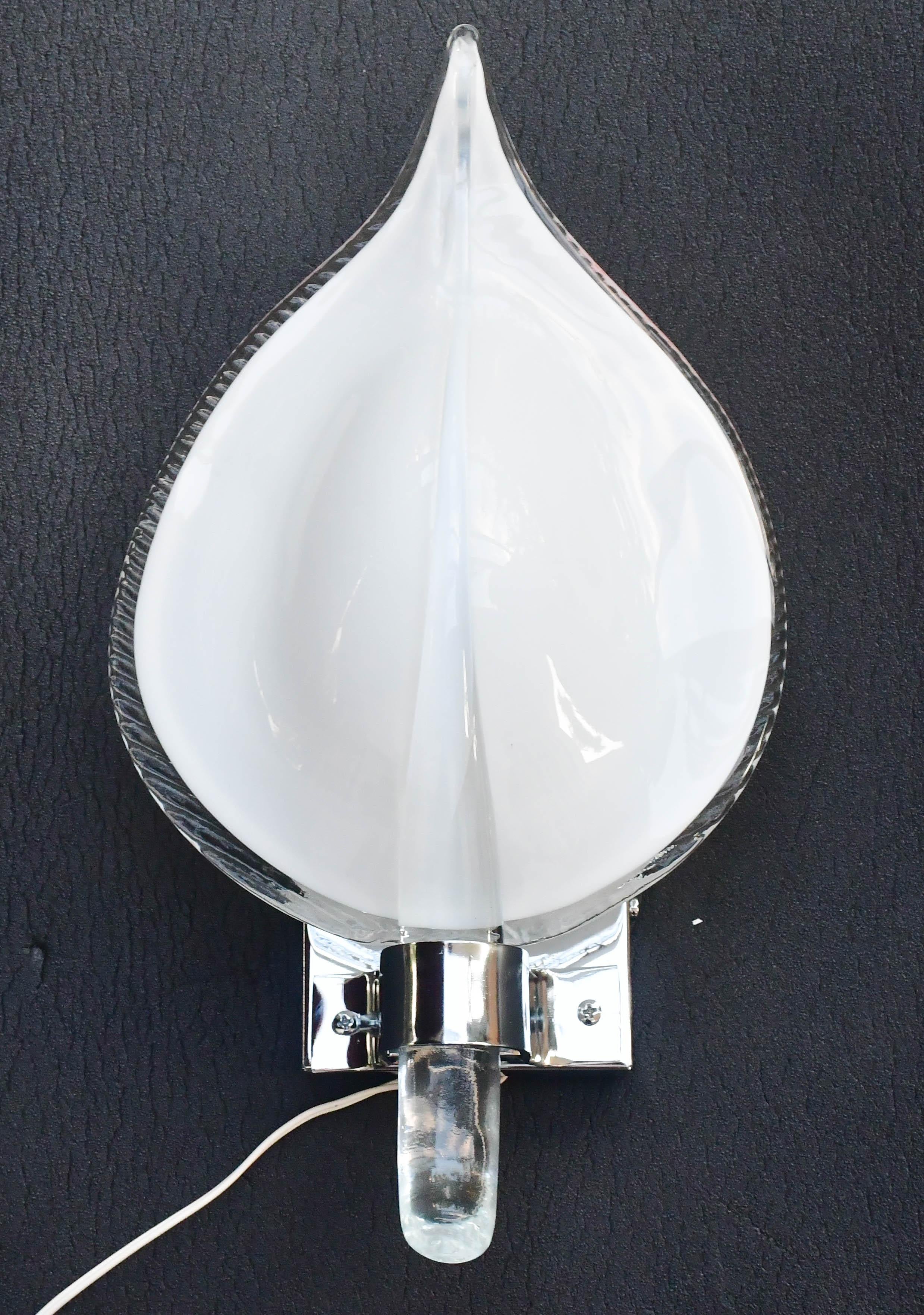 Stunning pair of wall sconces attributed to Franco Luce.
Design period 1970.
A beautiful and elegant design object for any space.
The structure of the sconces was completely made new in silver bath.
Also available to be wired for Usa.
Each light is