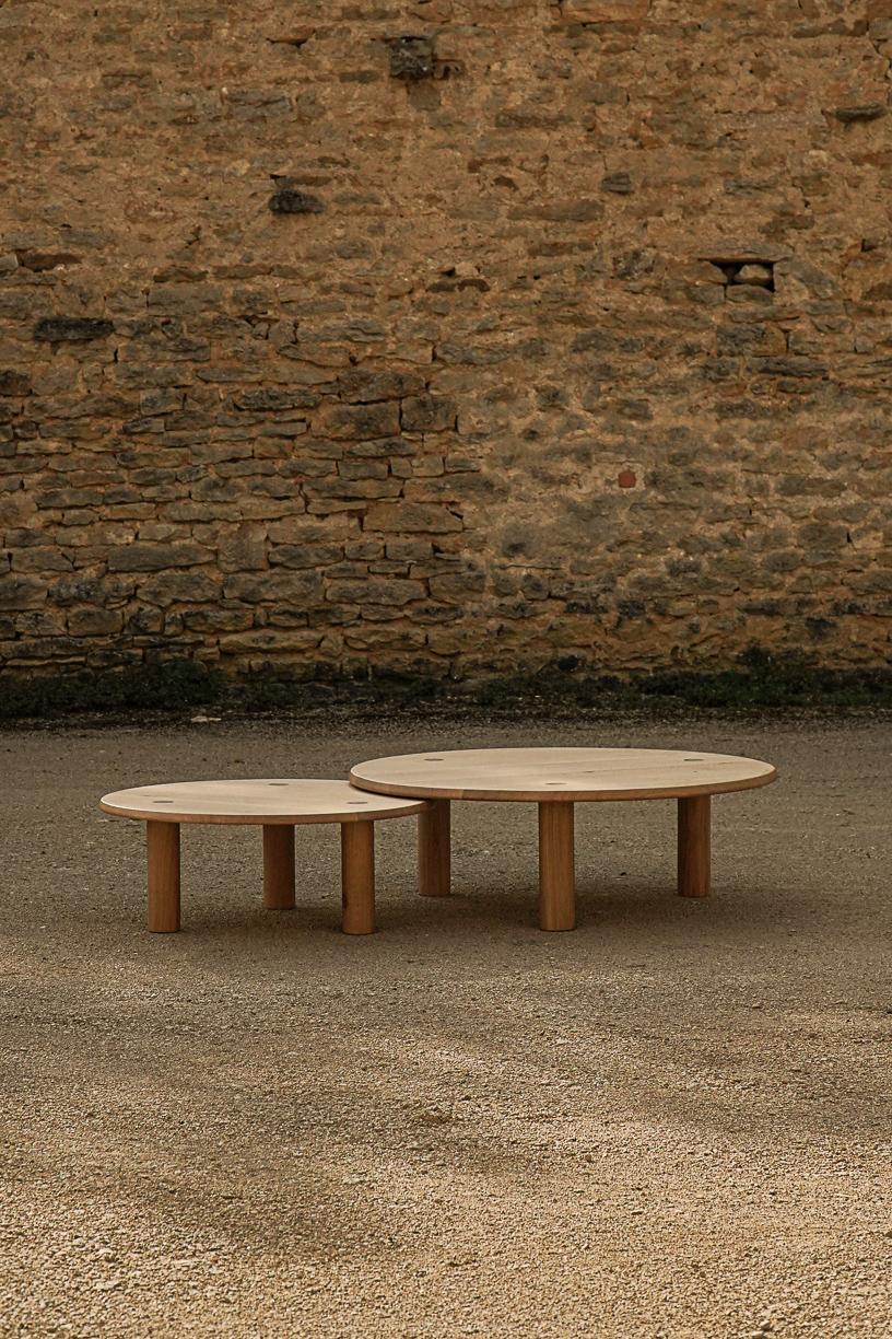 Set of 2 Nahele Varnished Oak Nesting Tables by La Lune
Dimensions: Ø 105 x H 34 cm.
Small: Ø 80 x H 30 cm.
Materials: Solid oak.

Varnished solid oak. Local wood. Produced in France. Custom sizes available.  Also available in oiled solid burnt.