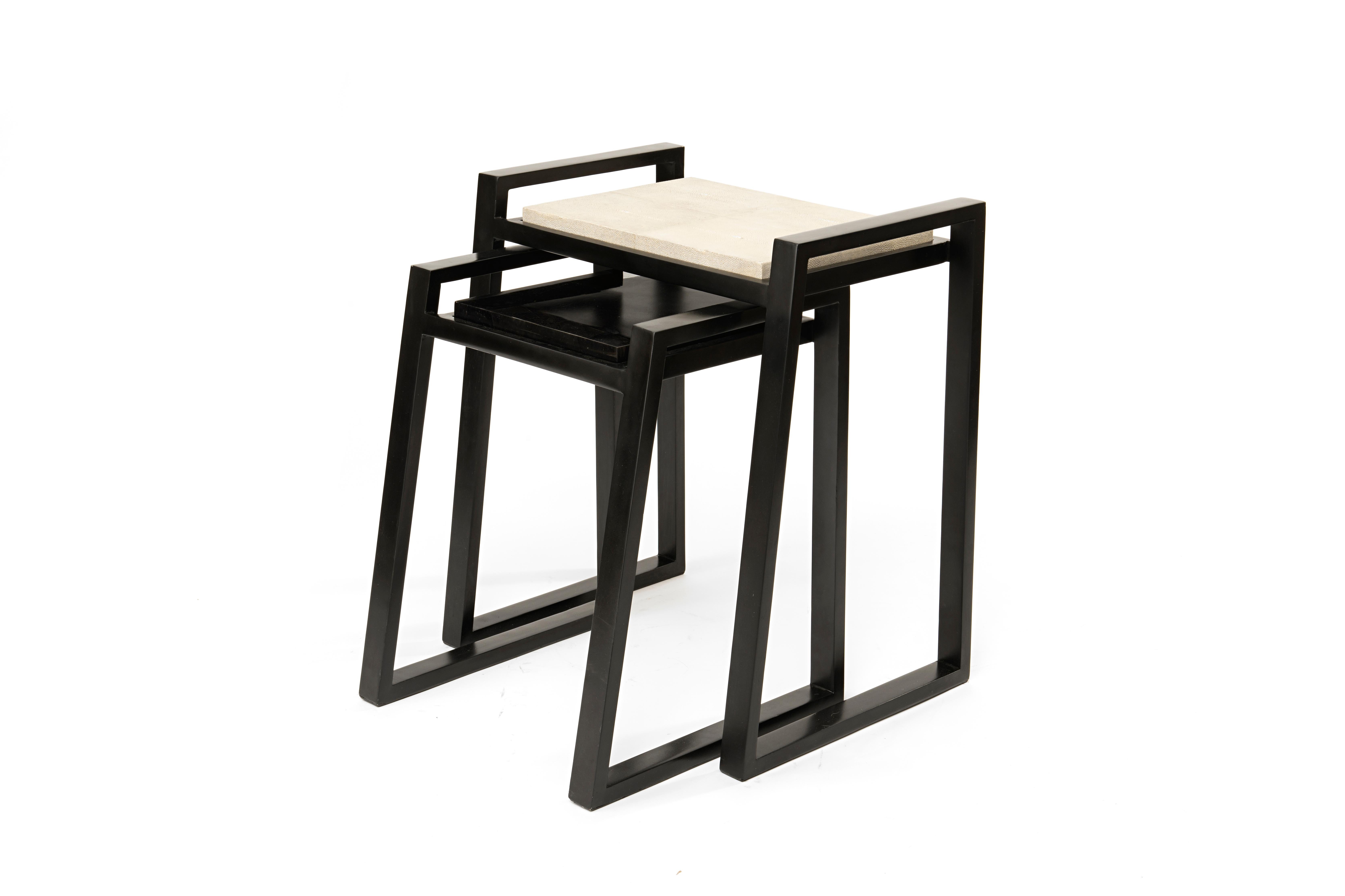The set of 2 nesting game tables by Kifu Paris is the perfect multi-functional luxury piece. The sleek and geometric tables can be used for backgammon or chess, and can be reversed to provide a flat surface. The tops are also removable to be used as