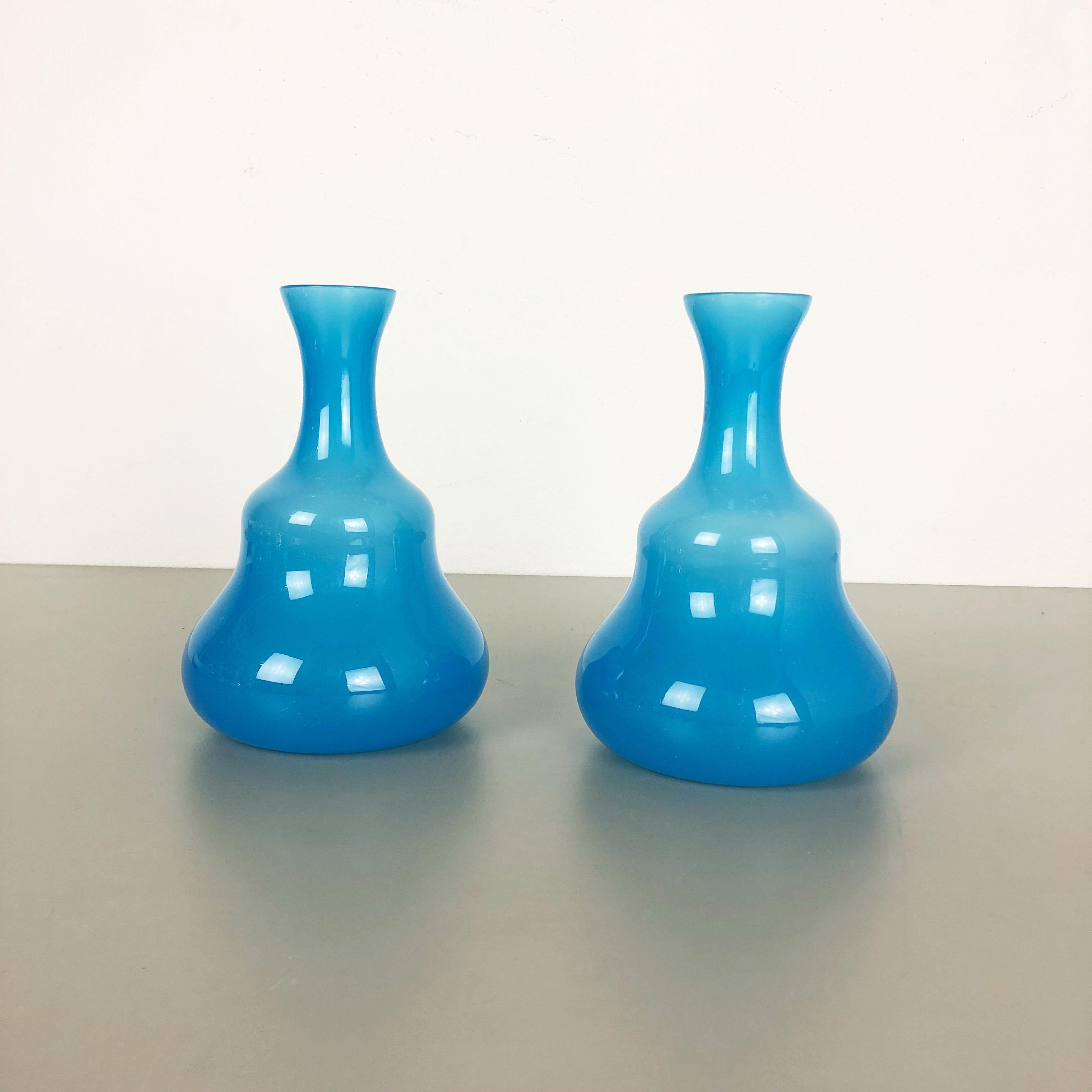 Article:

Murano opaline glass vases set of 2


Design:

Gino Cenedese


Producer:

Cenedese Vetri (marked underneath the vase)


Origin:

Murano, Italy


Decade:

1960s-1970s


This original set of 2 vase elements were