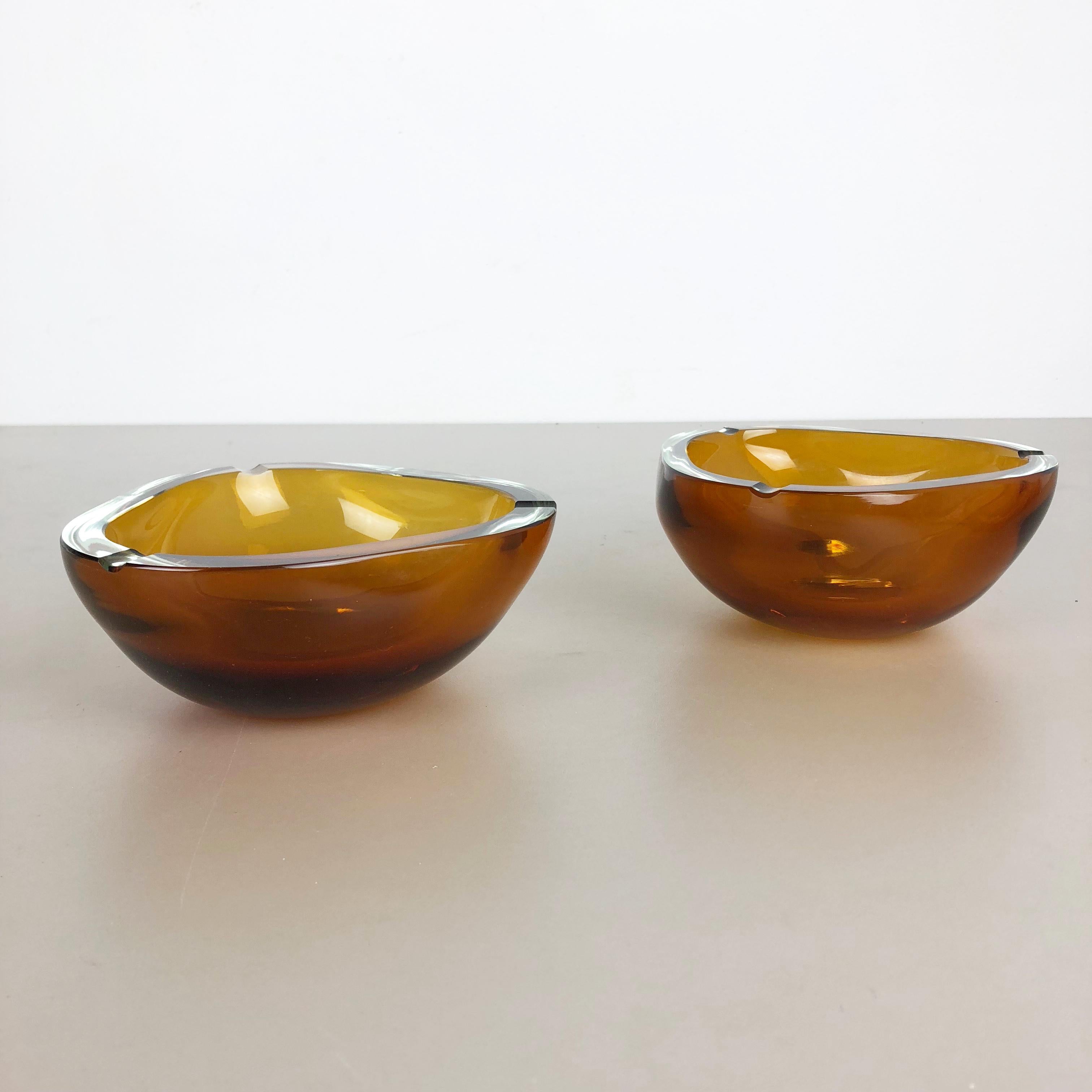 Article:

Murano glass ashtray bowl set of 2


Design:

Antonio da Ros


Producer:

Cenedese Vetri (marked underneath the bowl)


Origin:

Murano, Italy


Decade:

1960s-1970s


This original ashtray bowl set was produced in