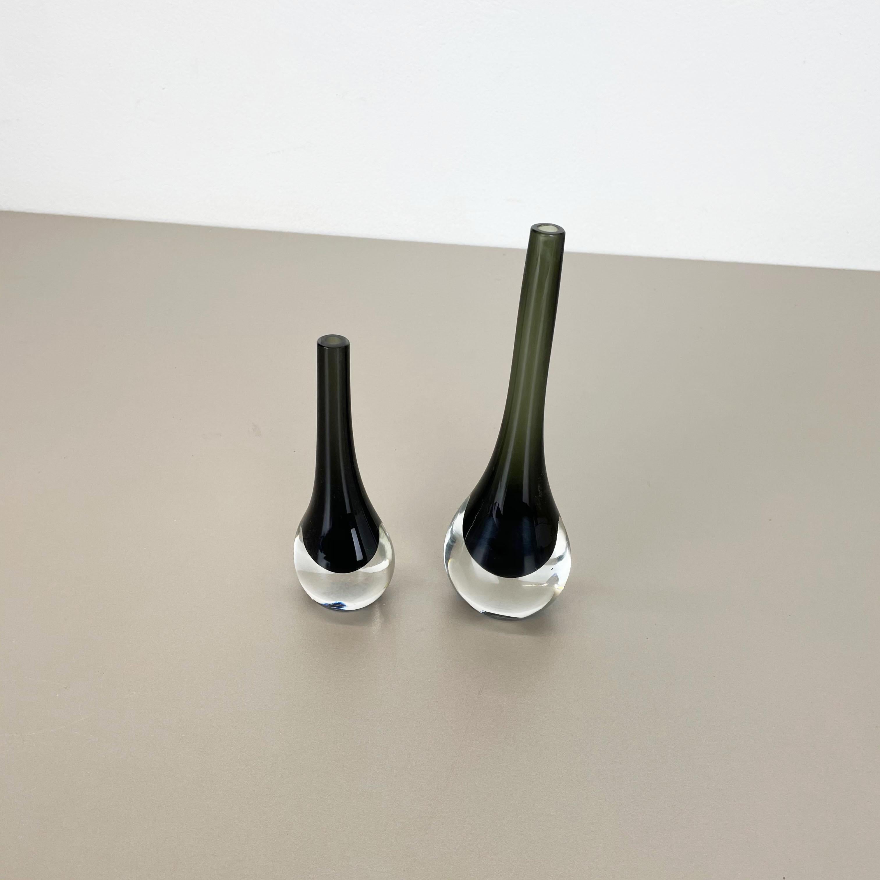 Article:

glass vases set of 2


Design:

Antonio da Ros


Producer:

Cenedese Vetri (marked underneath the bowl)


Origin:

Murano, Italy


Decade:

1960s-1970s


This original set was produced in the 1960s-1970s in Murano,
