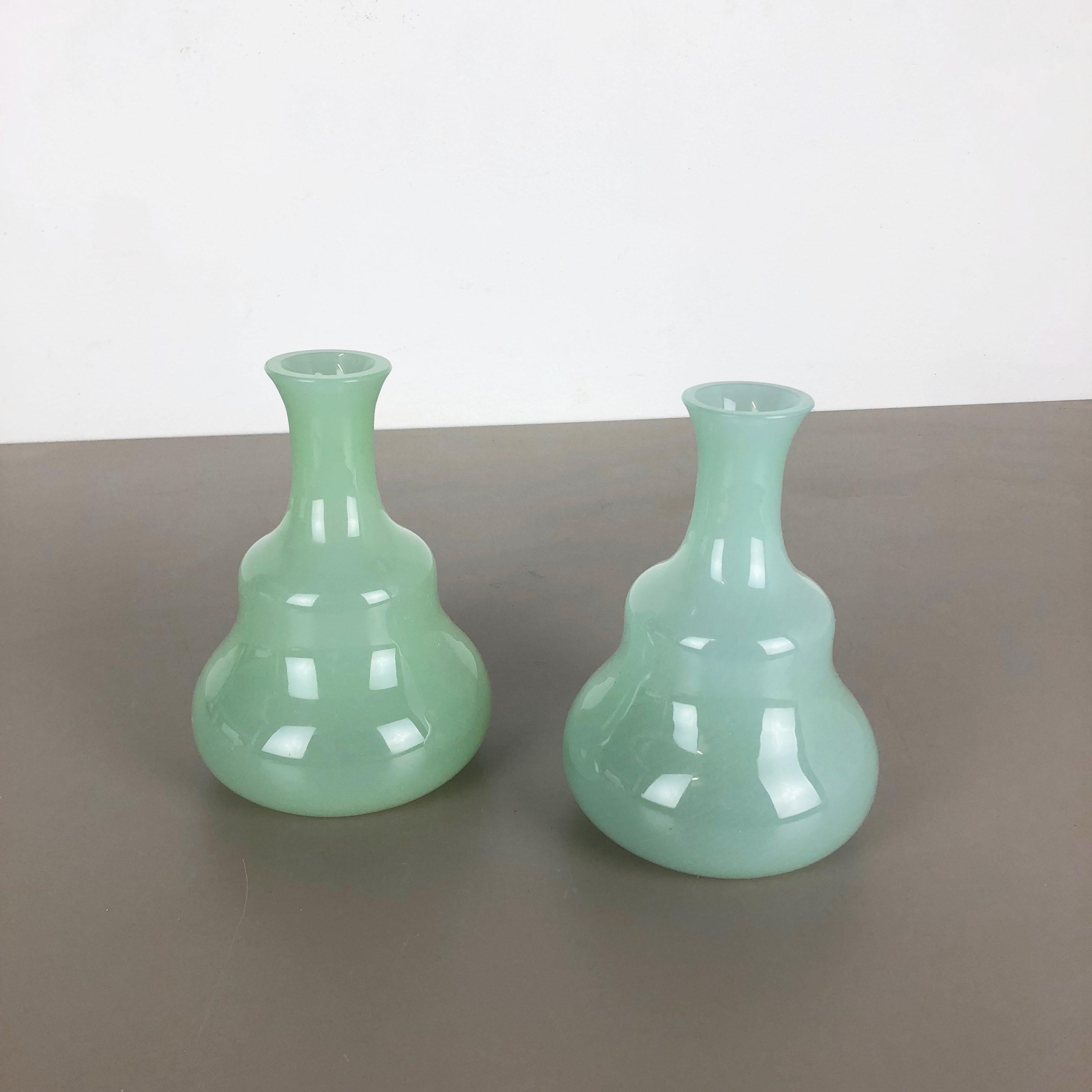 Article:

Murano opaline glass vases set of 2


Design:

Gino Cenedese


Producer:

Cenedese Vetri (marked underneath the vase)


Origin:

Murano, Italy


Decade:

1960s-1970s


This original set of 2 vase elements were