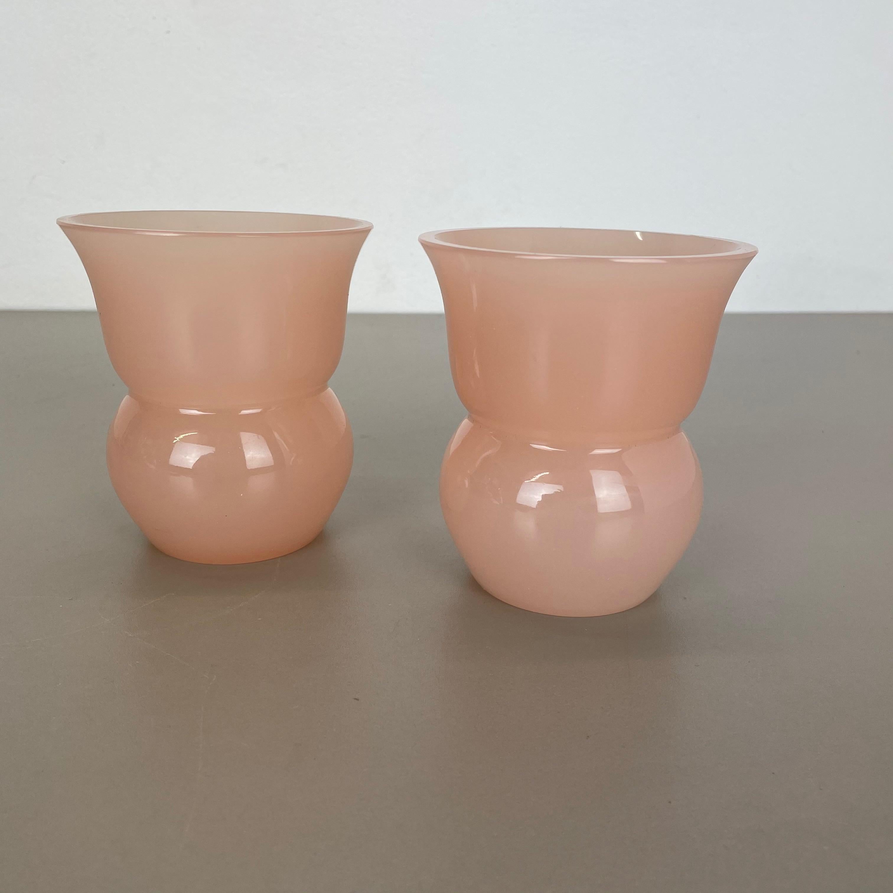 Article:

Murano opaline glass vases set of 2


Design:

Gino Cenedese


Producer:

Cenedese Vetri (marked underneath the vase)


Origin:

Murano, Italy


Decade:

1960s-1970s


This original set of 2 vase elements were