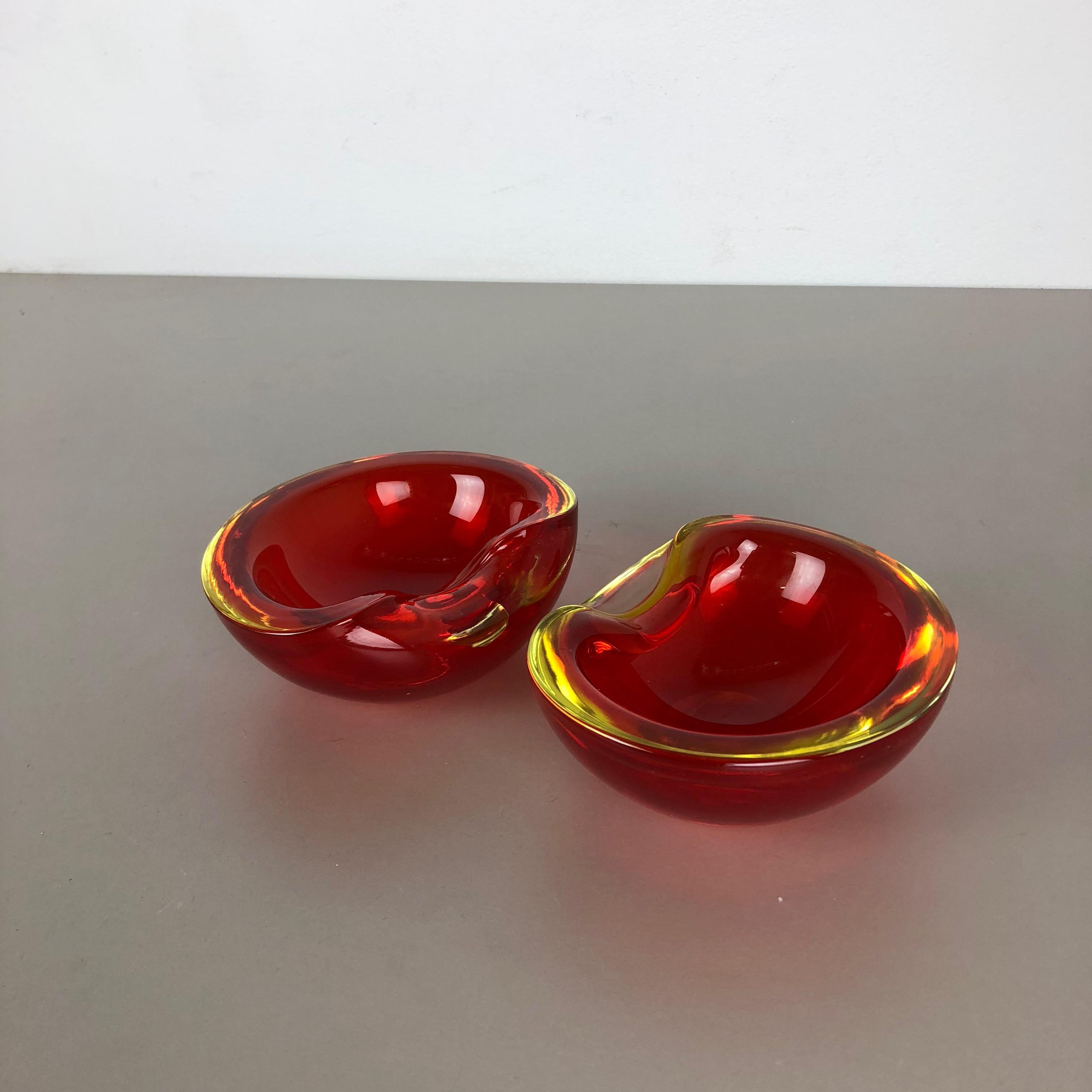 Article:

Murano glass bowl set of 2



Producer:

Cenedese Vetri (marked underneath the bowl)


Origin:

Murano, Italy


Decade:

1960s-1970s


This original glass bowl set was produced in the 1960s-1970s in Murano, Italy. It