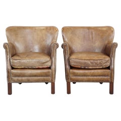 Set of 2 nice, subtle cowhide armchairs with reversible kilim seat cushions