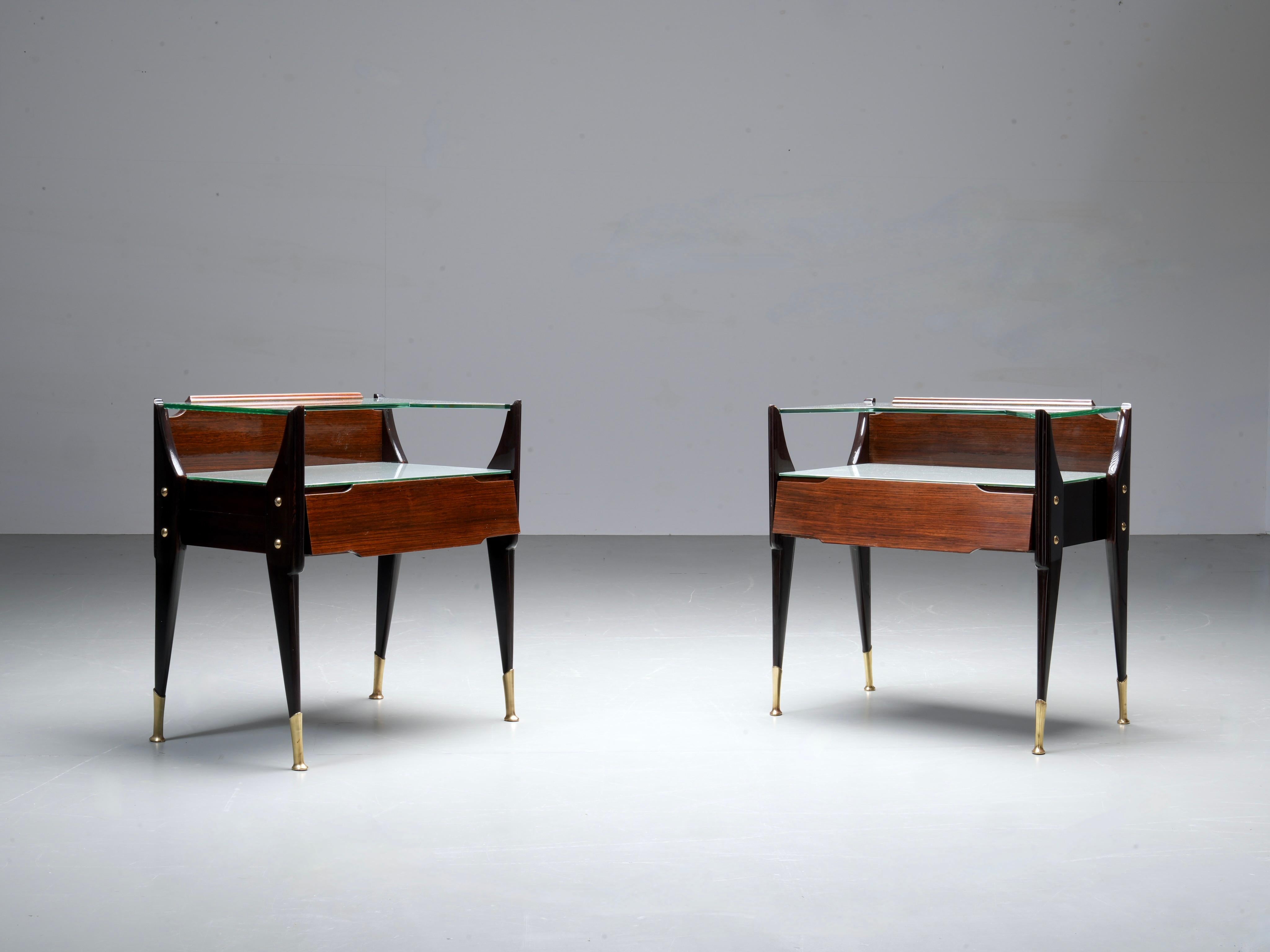Set of 2 Night Stands by La Permanente Mobili Cantù, Italy, 1950's

Very elegantly executed set night stands by La Permanente Mobili Cantù in dark lacquered wood, cut glass and with nicely detailed brass feet. What stands out are the shapes of the