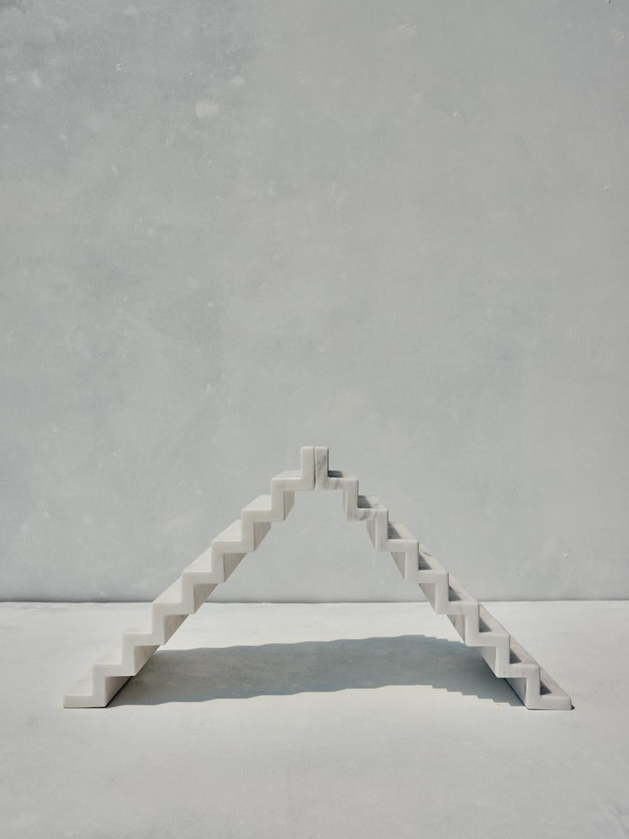 Set of 2 Niis zig-zag tray by Faye Tsakalides. 
Dimensions: 18.5 W x 27 L x 3 H cm (each)
Materials: White Volakas marble. 
Technique: Crafted from a single piece of marble. Hand-crafted, Polished. Mat finished. 

Faye Tsakalides is a Greek