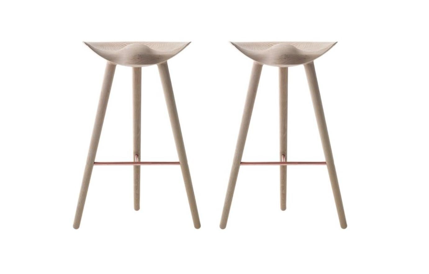 Set of 2 oak and copper bar stools by Lassen
Dimensions: H 77 x W 36 x L 55.5 cm
Materials: oak, copper

In 1942 Mogens Lassen designed the Stool ML42 as a piece for a furniture exhibition held at the Danish Museum of Decorative Art. He took