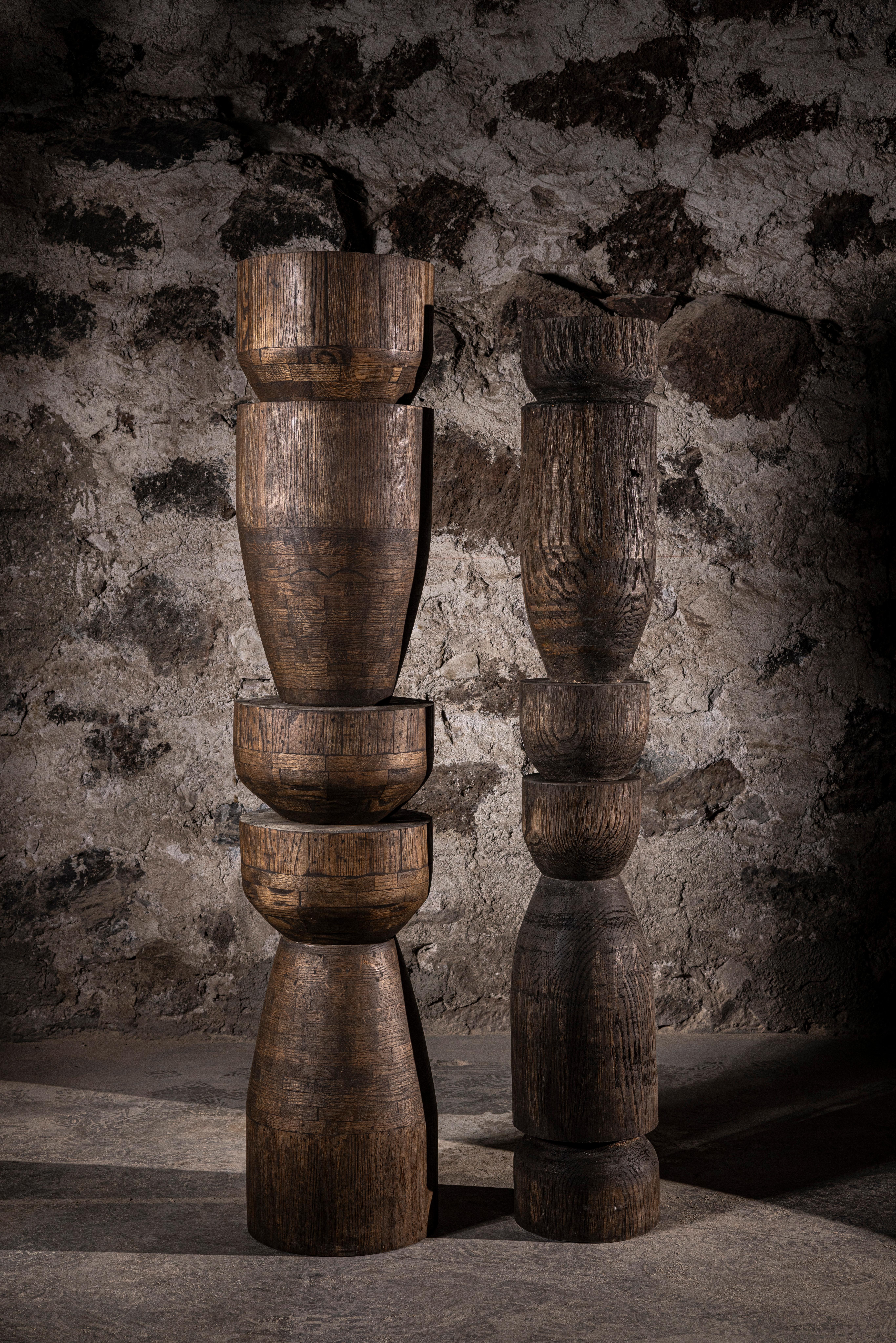 Set Of 2 Oak Totems in Dark Stained Oak with a Waxed Finish by No Age Studio
Dimensions: Large: Ø 30.5 x H 152.4 cm. 
Small: Ø 20.3 x H 142.2 cm.
Materials: Oak.

No Age Studio - Handcrafted Furniture

Every piece we create is made to order, crafted